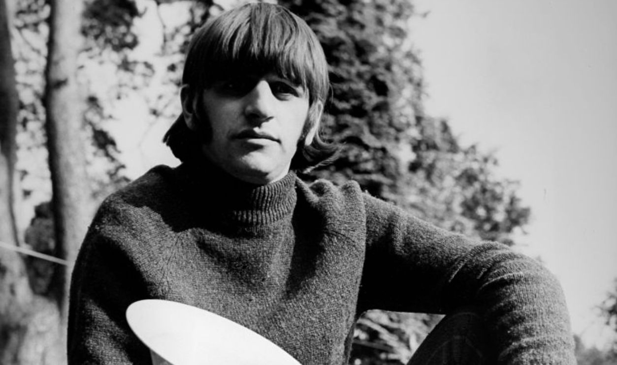 UNITED KINGDOM - CIRCA 1960: Ringo Starr listens to a song that was a hit before his mother was born, in the United Kingdom, circa 1960.