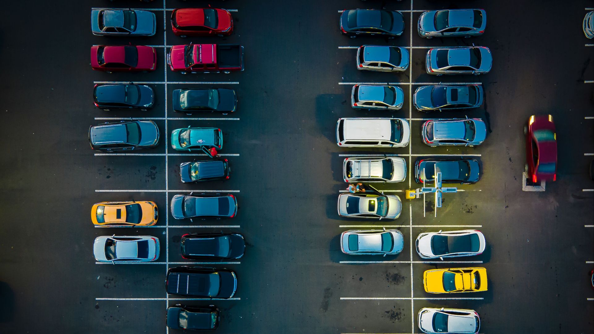 Aerial shot of a parking lot in Vista Alegre, Panama, showcasing various parked cars.