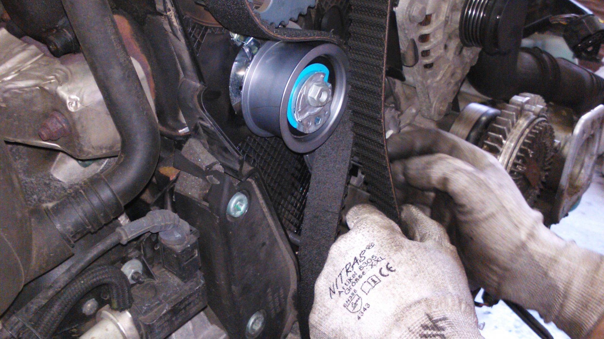 Replacing a timing belt of car.
