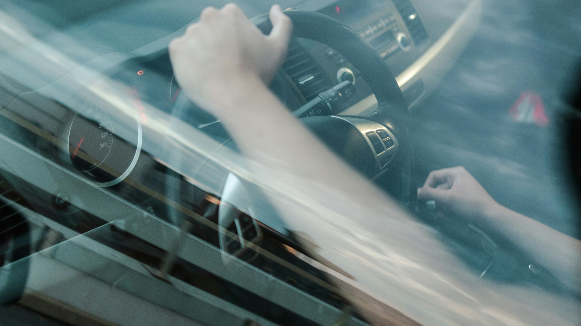 person driving car during daytime