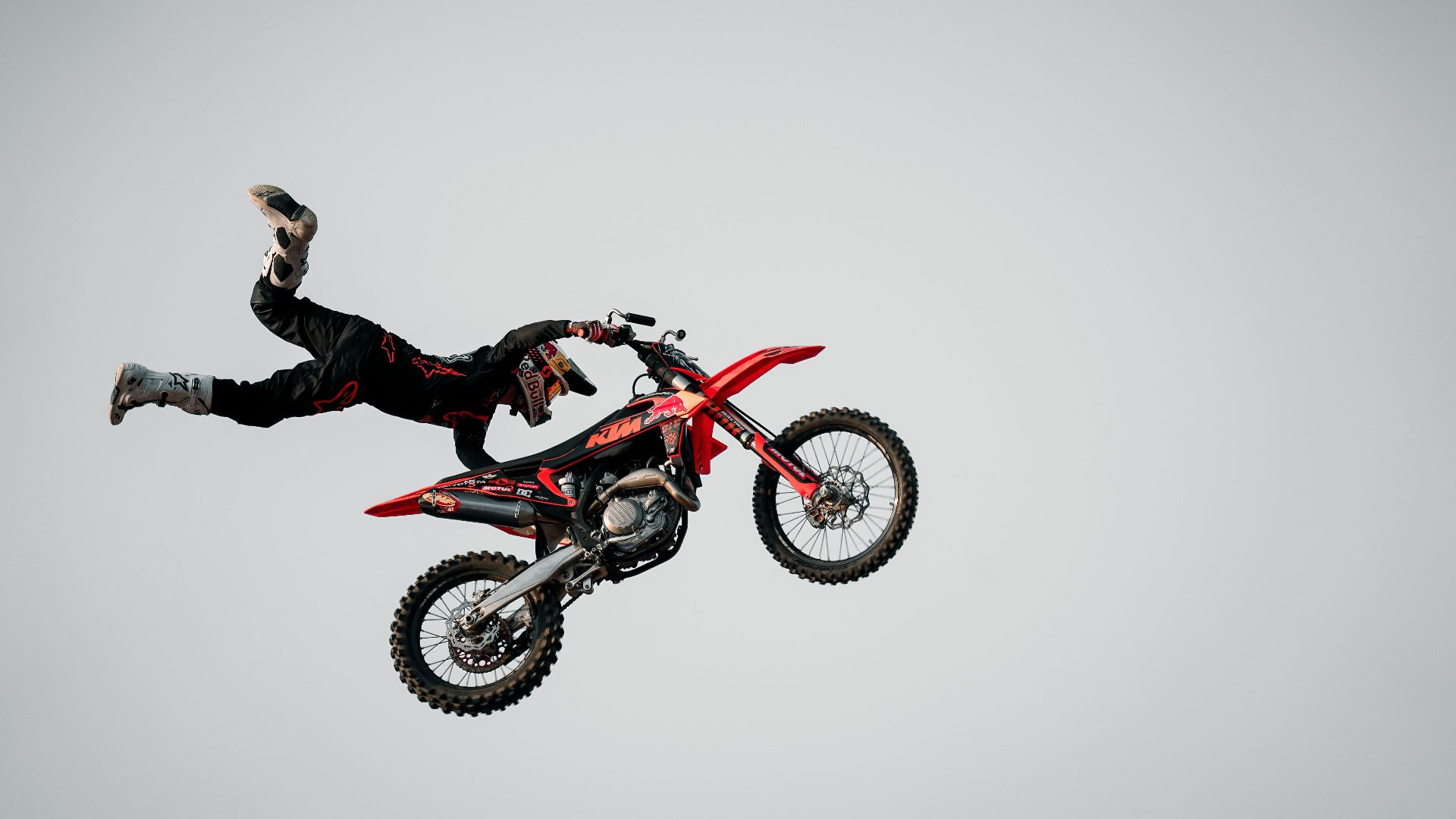 Dynamic capture of a motorcyclist performing an extreme stunt in the air.