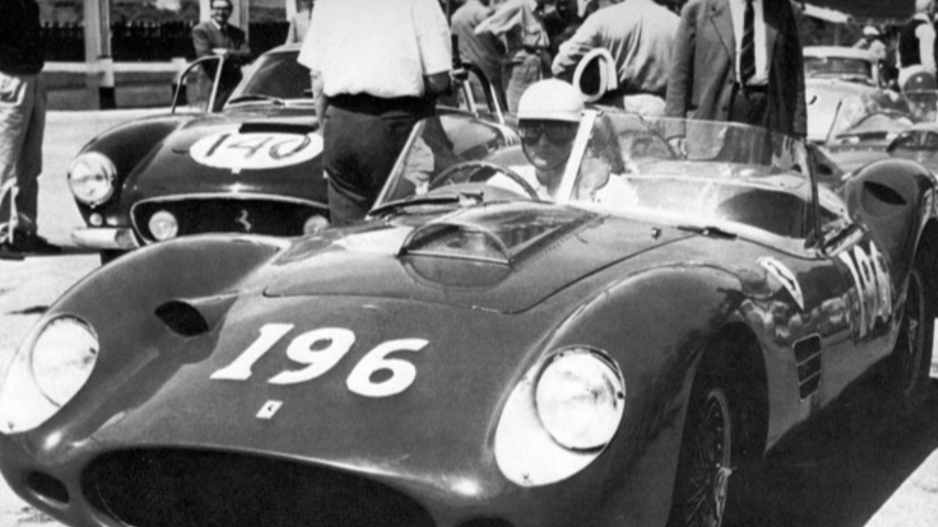 The 1960 Ferrari 250 Testa Rossa TRI/60 s/n 0780TR was entry #196 at Targa Florio on 8 May 1960, to be driven by Cliff Allison and Phil Hill. This is before the race, and by the helmet and face, it looks like Phil Bill. However, the car was entirely wreck