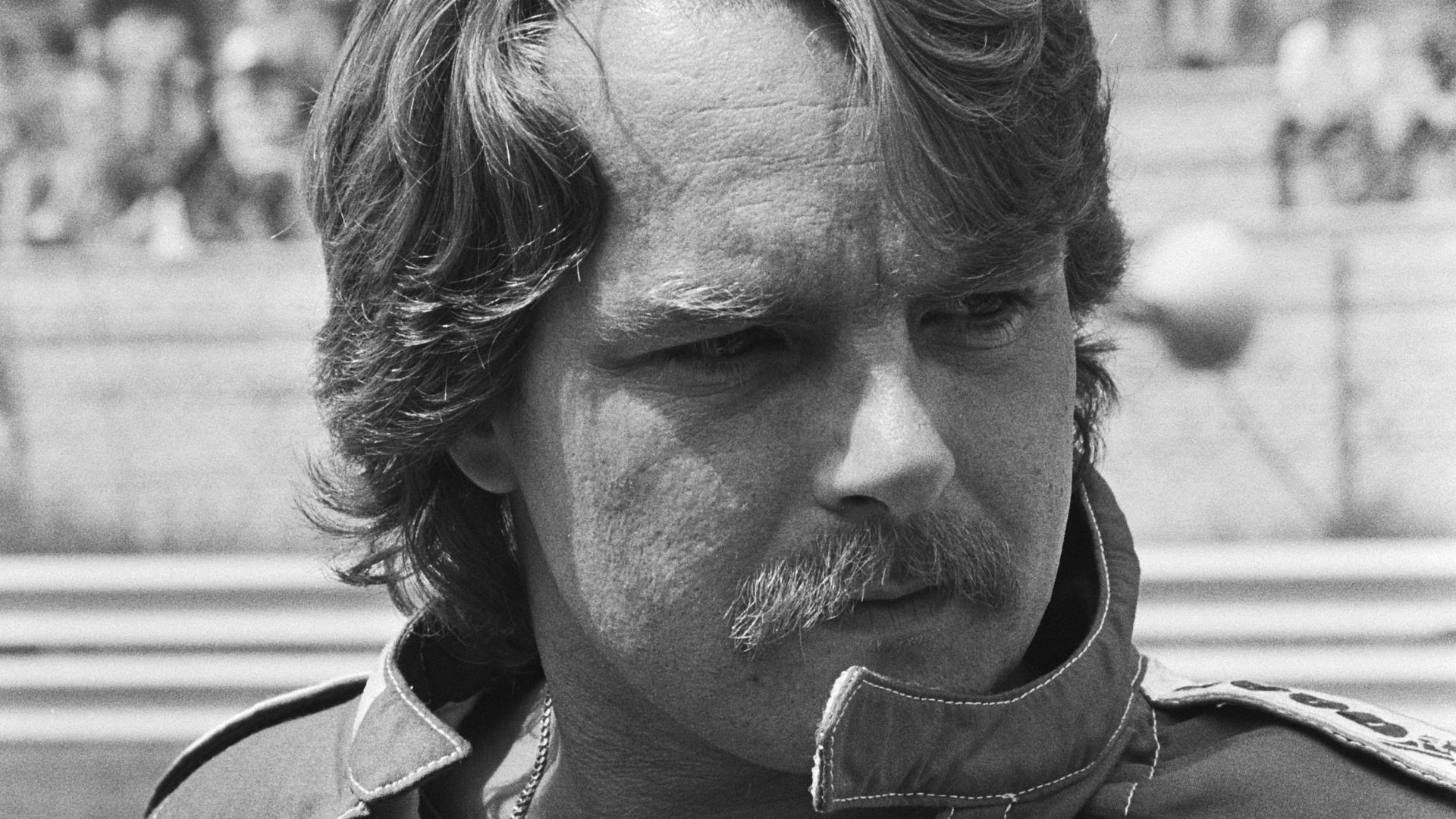 Keke Rosberg in a black and white photographic portait taken at the 1982 Dutch Grand Prix