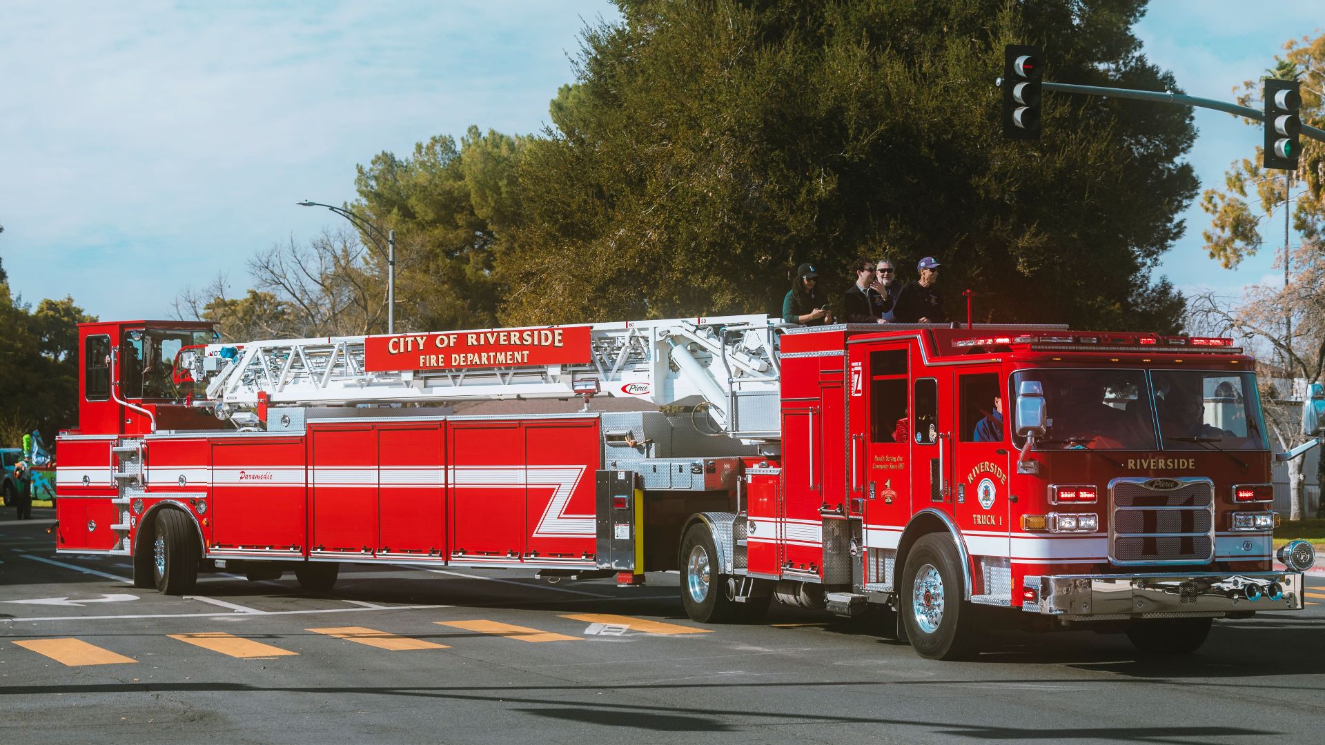Bright red fire truck from City of Riverside Fire Department on a sunny day.