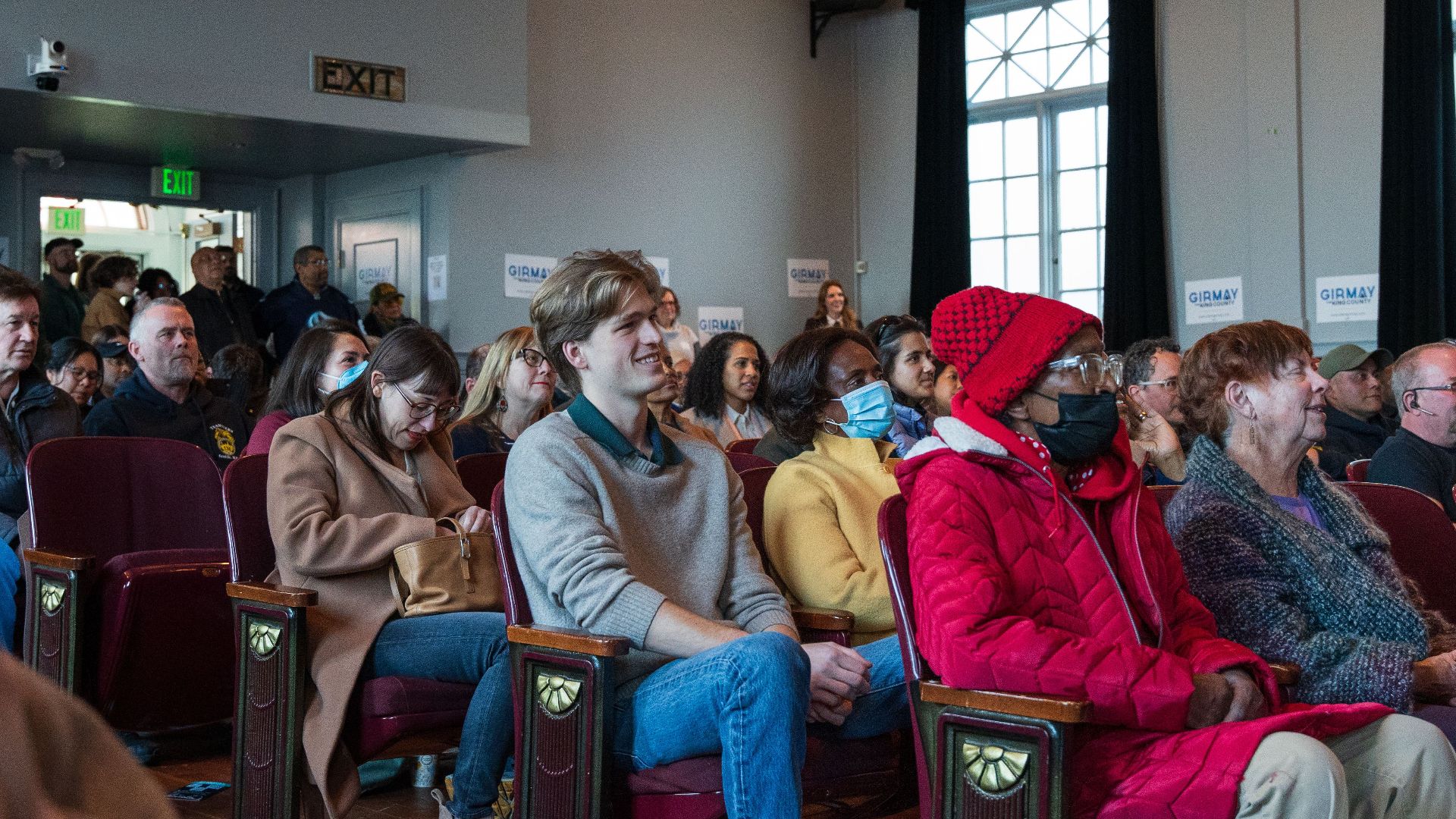 A diverse group of people attending a community meeting in Seattle, Washington.