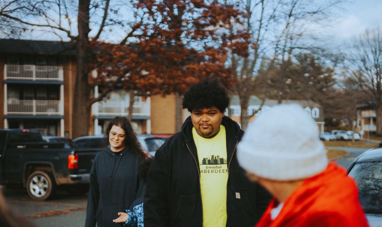 Family walking together in a neighborhood, highlighting community bonds
