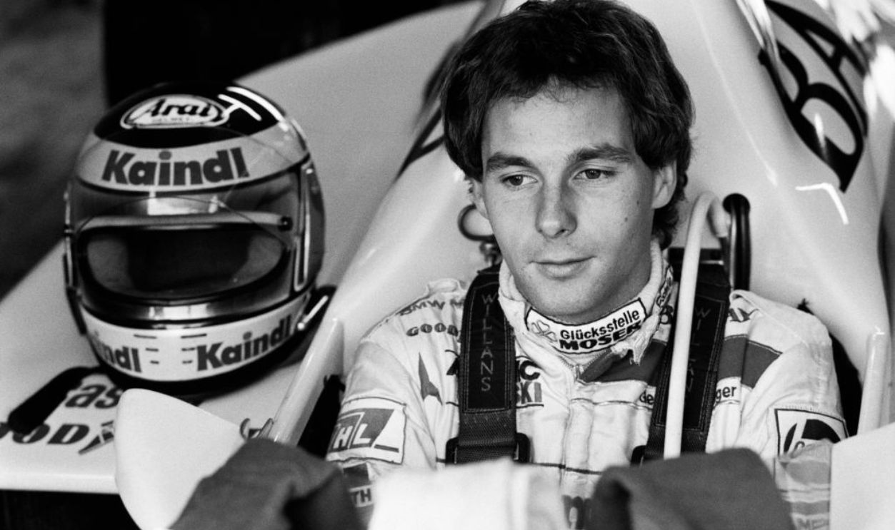 Formula One Grand Prix racing driver Gerhard Berger, driving for Arrows-BMW, sits in his car in the pit lane garage ahead of competing in a qualifying session for the 1985 British Grand Prix at the Siverstone Circuit, near Towcester, Northamptonshire, U.K., on Saturday, July 20, 1985.