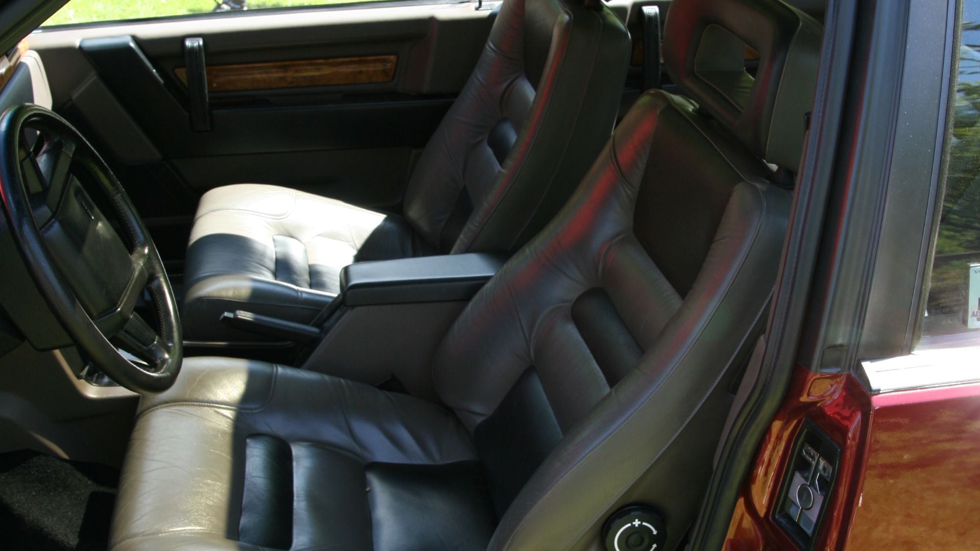The front seats of a 1988 Volvo 780 parked at the Sofiero Classic car show at Sofiero castle in Helsingborg, Sweden.