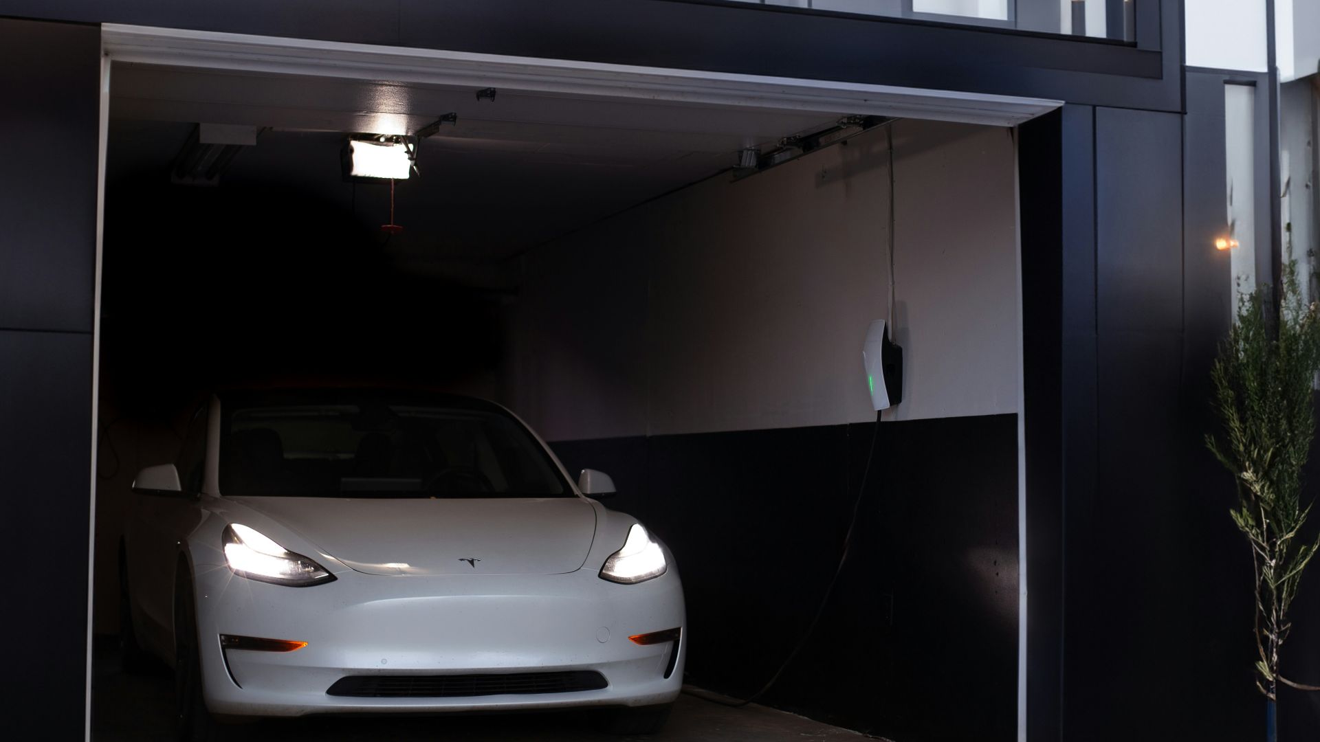 a white car is parked in a garage