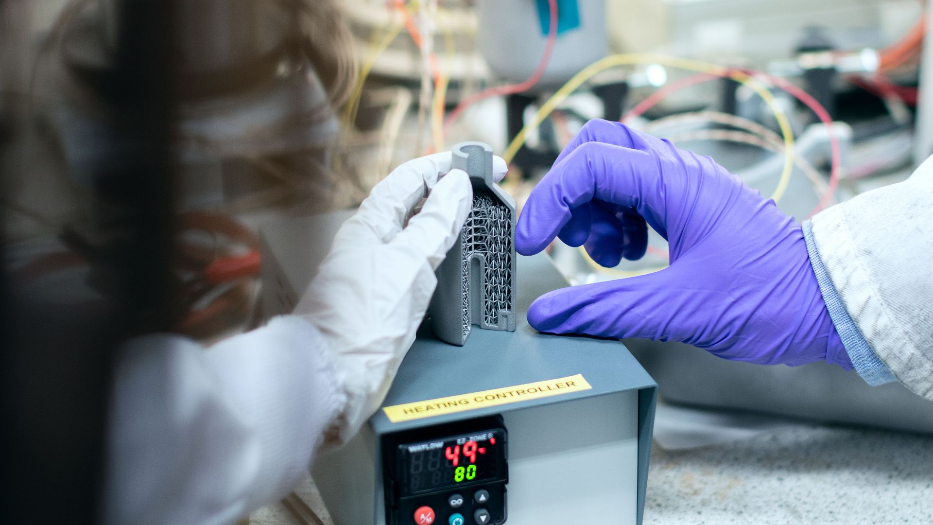 Scientist testing materials in a laboratory setting for clean energy solutions.