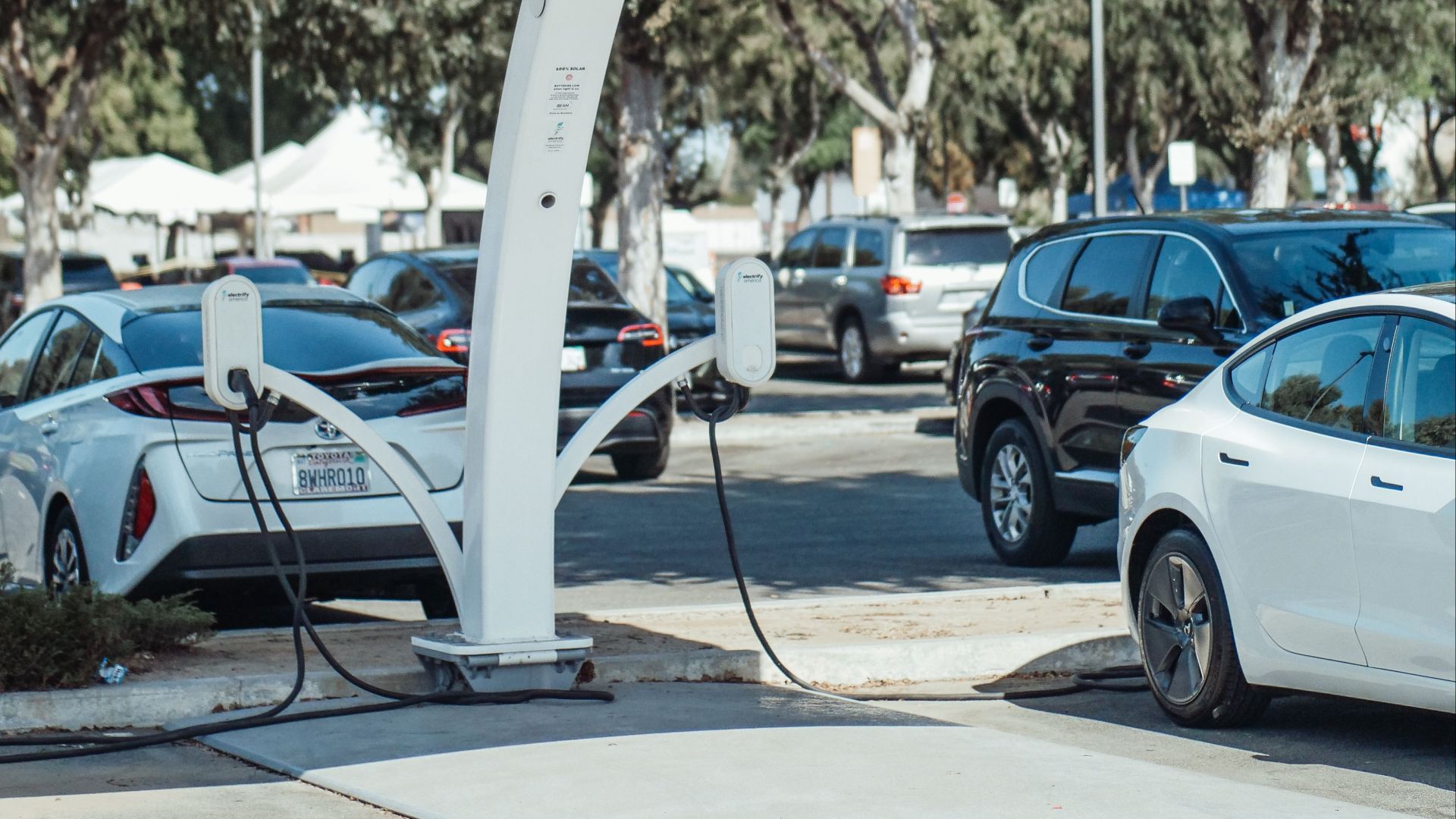 Eco-friendly solar panel charging station for electric vehicles outdoors.