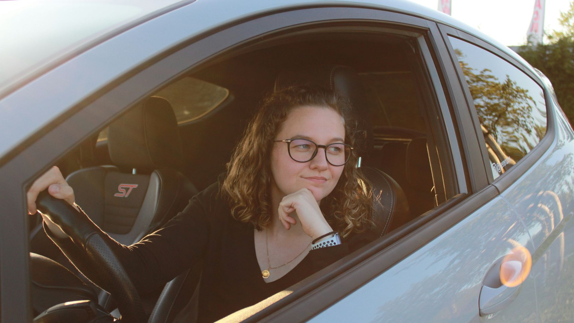 a woman sitting in a car