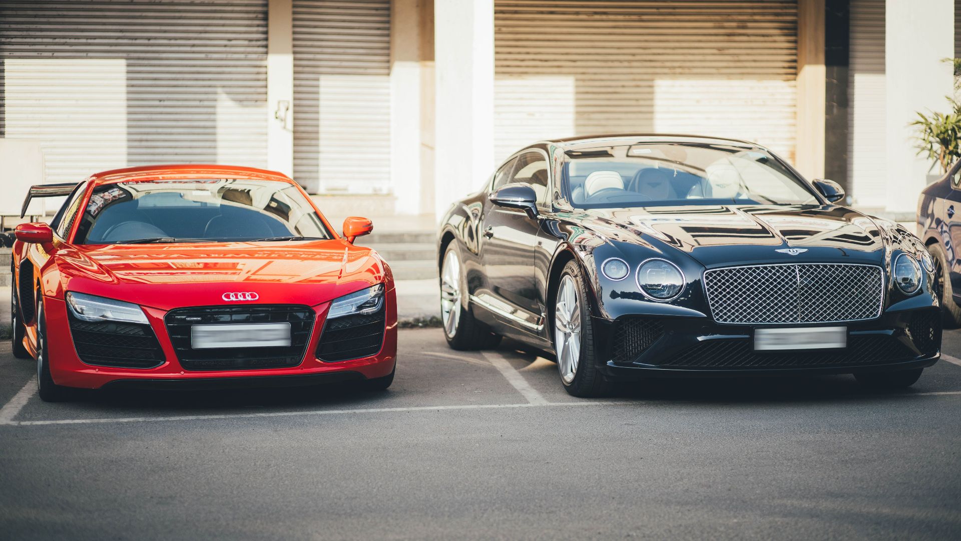 Audi R8 and Bentley Continental GT showcased in a Chandigarh parking area, capturing luxury car elegance.
