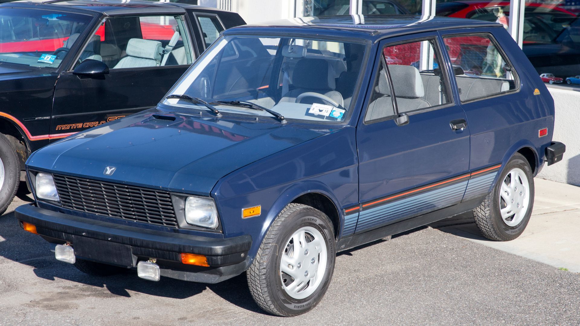 1988 Yugo GV with 58,230 miles. 1.1-liter engine and a four-speed manual. The original owner (in Michigan) splurged $139 for the rear window/washer combo. Shame about the hubcaps, otherwise a cool car.