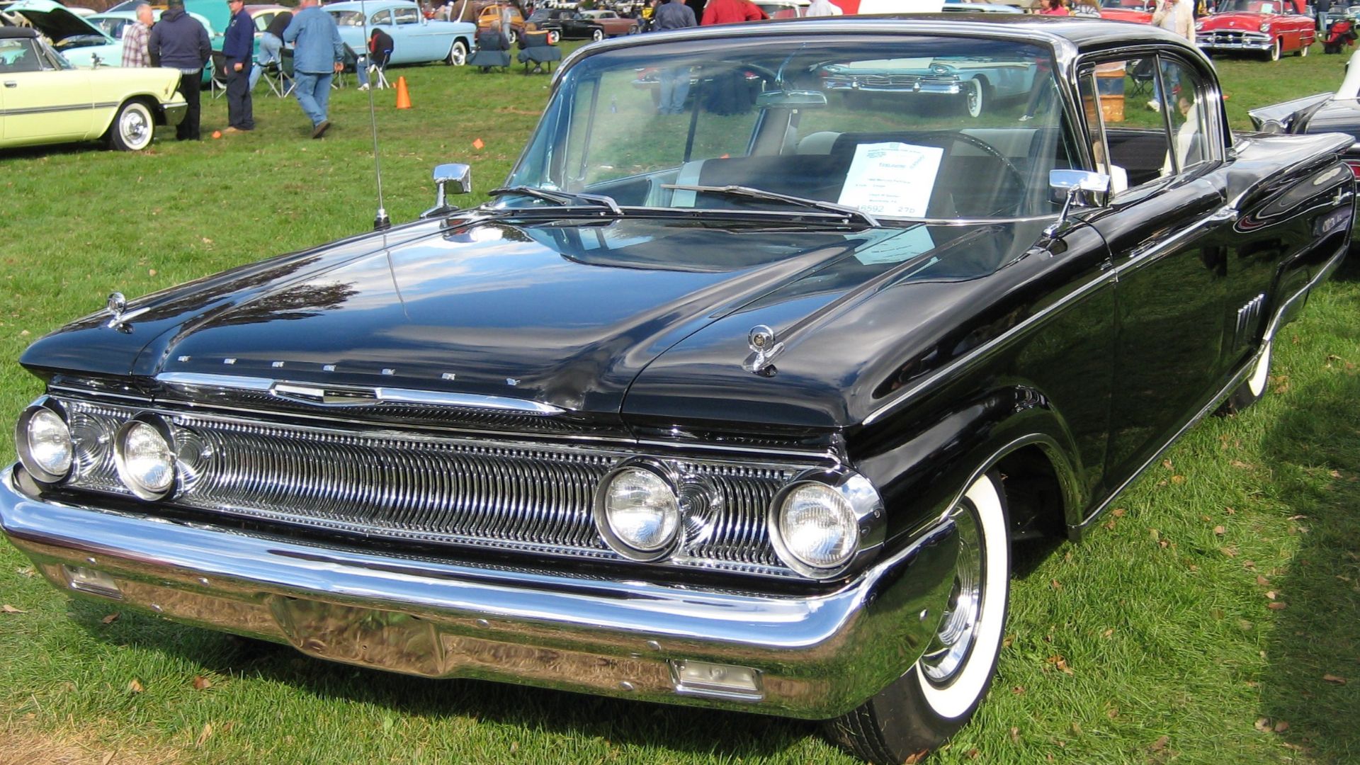At the Saturday judged car show, AACA Fall Meet, Hershey, Pennsylvania, October 2009.  I learned to drive with a '60 Commuter wagon, in black like this one.  I well remember the big windshield and how far away the dashboard was.