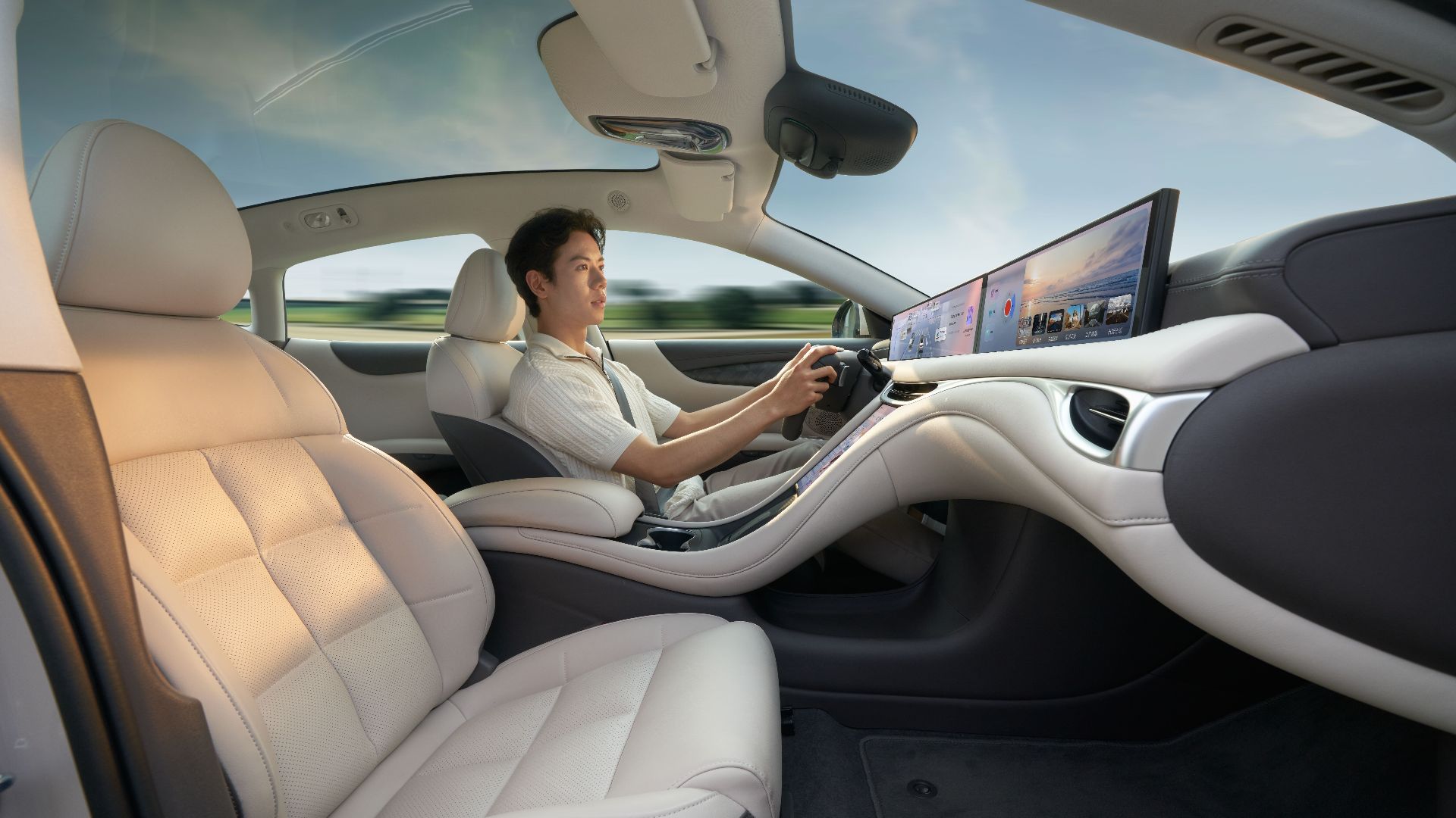 A modern electric car interior showcasing advanced technology with a driver enjoying a smooth ride.