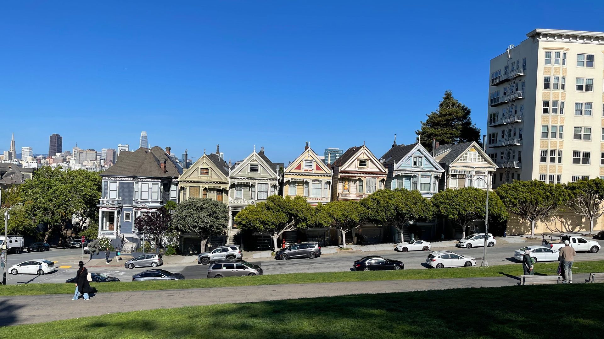 The famous Painted Ladies houses of San Francisco against a sunny, clear blue sky backdrop.