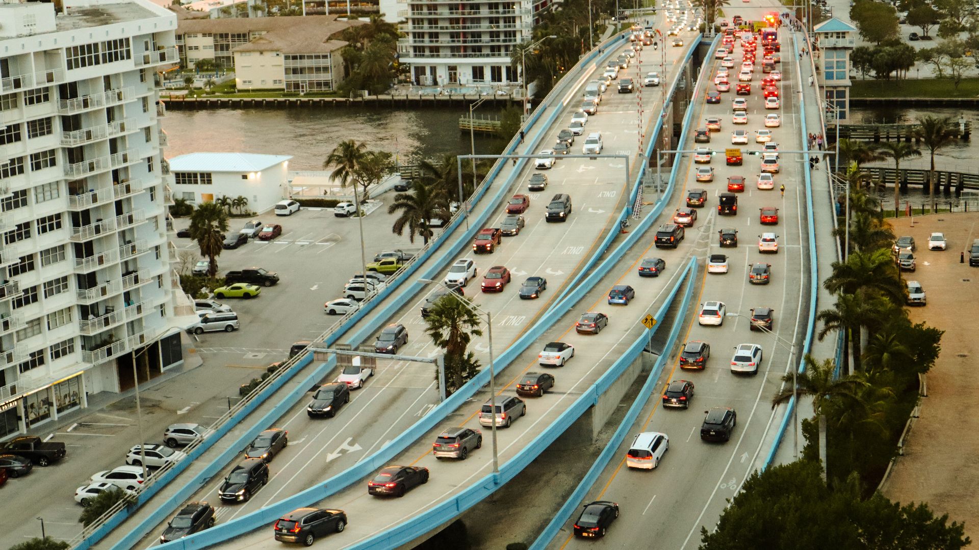 High angle view of urban traffic on a multi-lane road, showcasing city life and infrastructure.
