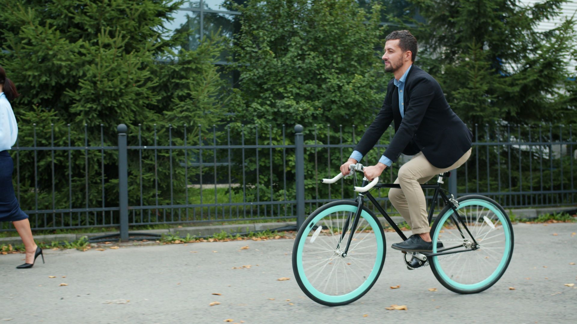 Professional man cycling to work, embracing eco-friendly commuting.