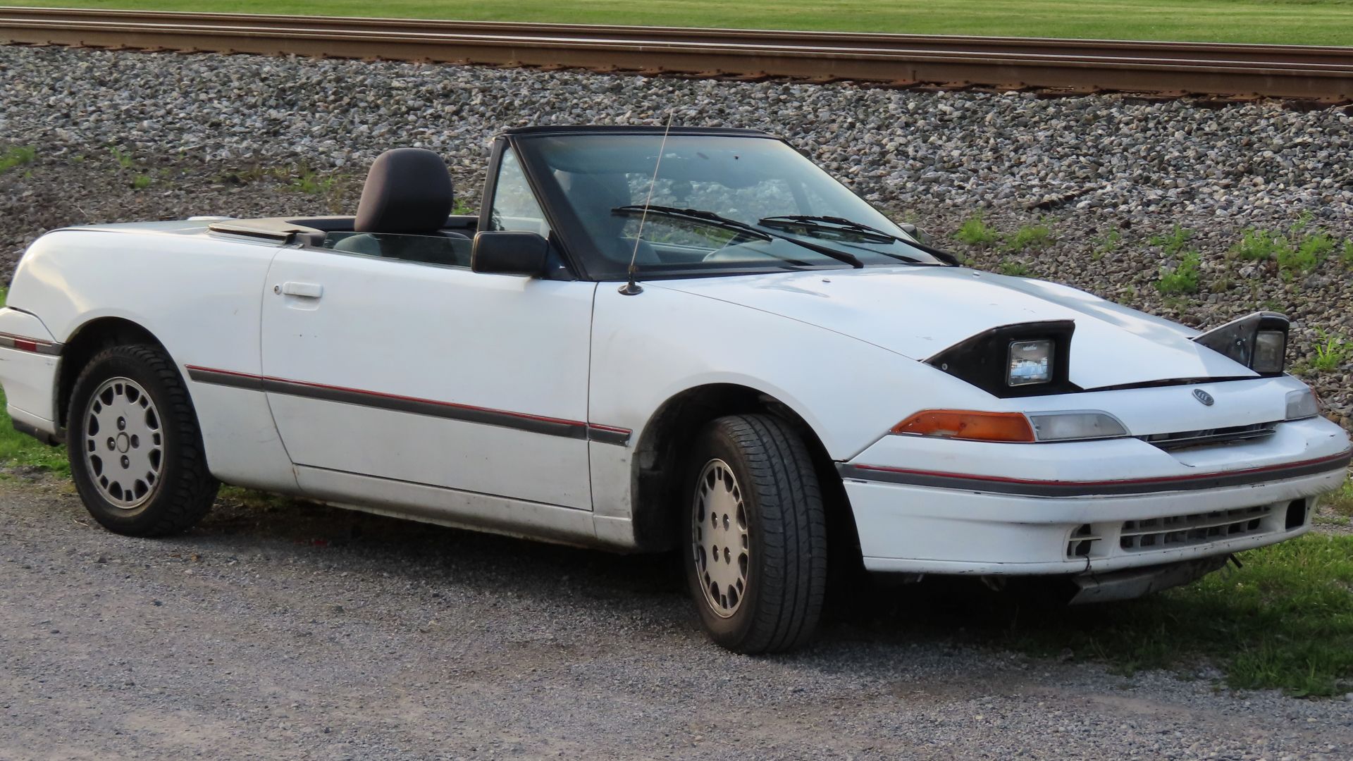 1991 Mercury Capri photographed in Lowellville, Ohio. Finished in Polar White.