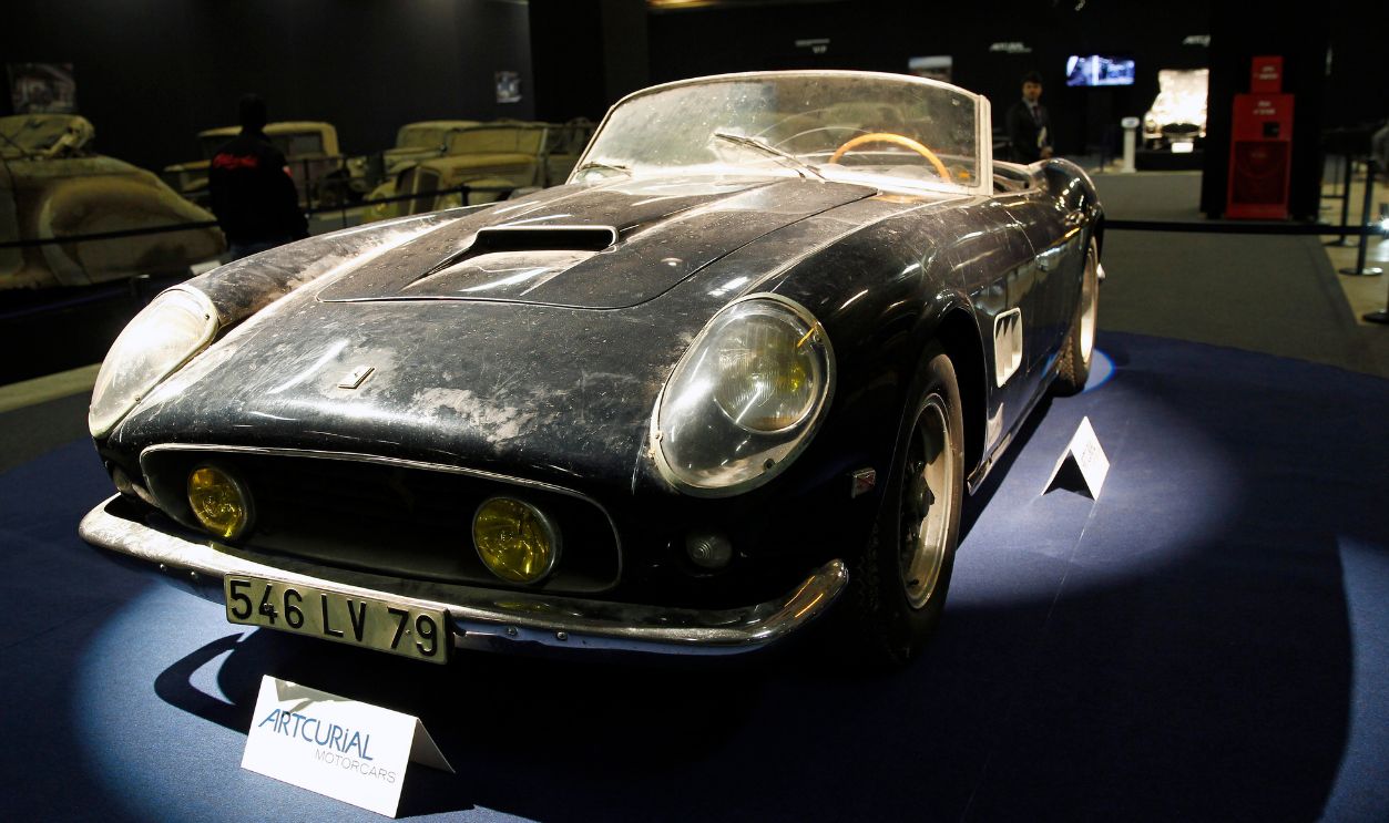 Ferrari 250 GT California SWB spyder is displayed for auction during the Retromobile show on February 03, 2015, in Paris, France. This car had belonged to the French actor Alain Delon is estimated between 9 500 000 and 12 000 000 euros for the auction this Friday. 60 rusting cars, which include this vintage Ferrari California Spider, a Bugatti and a very rare Maserati, were found gathering dust and hidden under piles of newspapers in garages and outbuildings at a property in France belonged at the entrepreneur Roger Baillon.