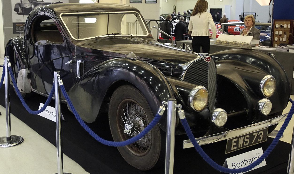 Getty Images - 83867794 - The 1937 Bugatti 57S originally owned by Earl Howe is displayed in the Bonham's auction room at Olympia, in London on December 1, 2008 ahead of it's sale in the Bonham's 