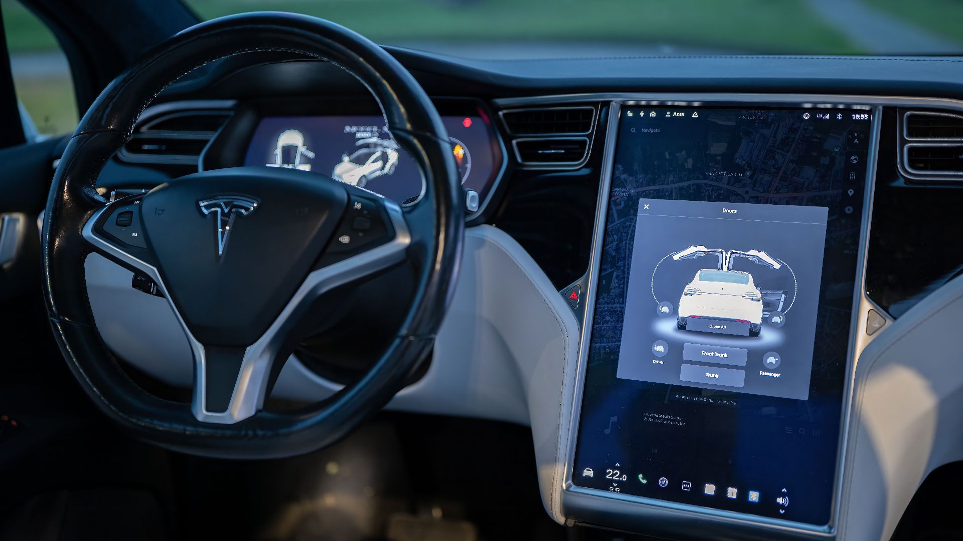 Interior shot of a modern electric car showcasing a sleek design and advanced touchscreen technology.