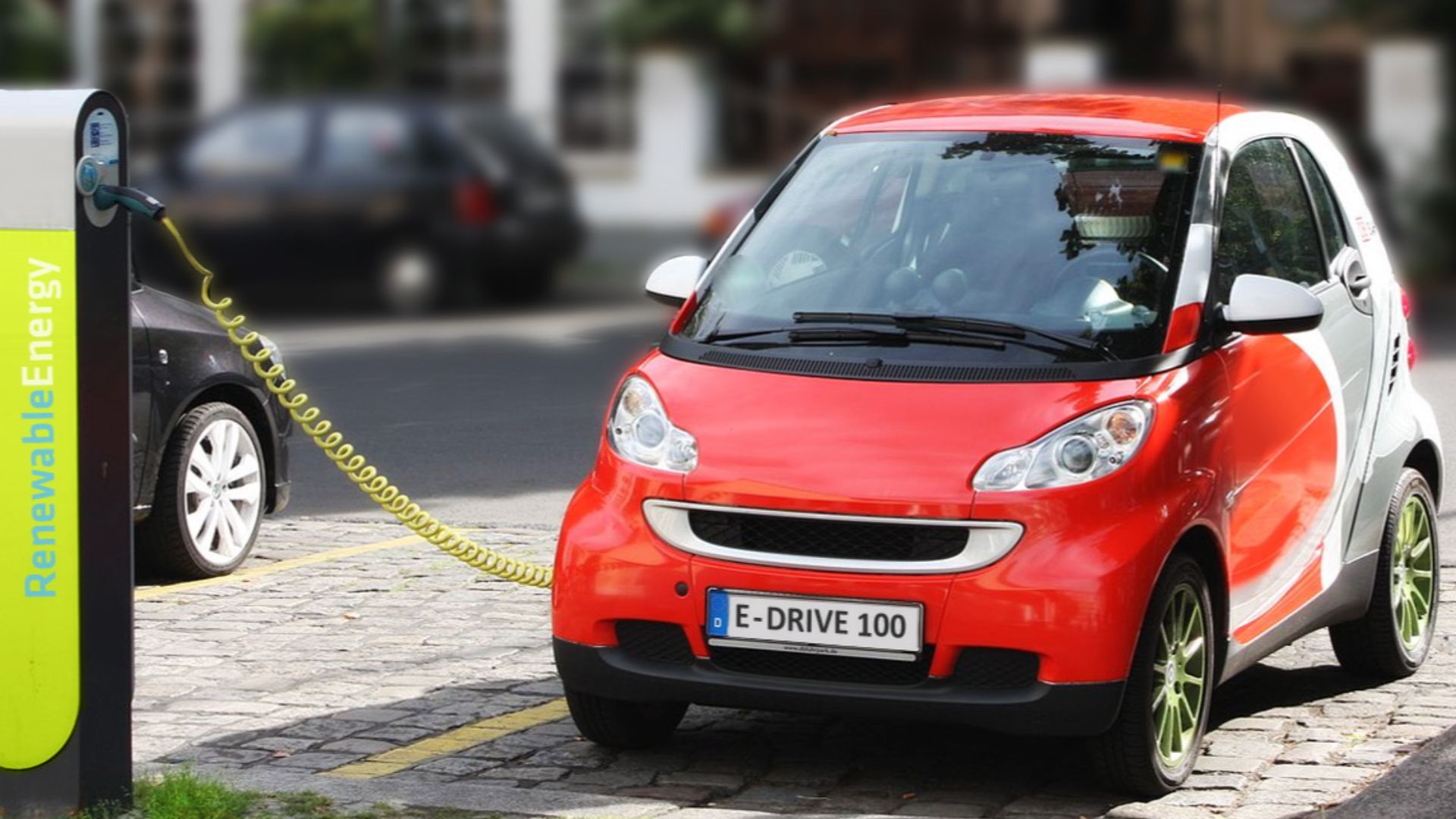 electric car recharging in Berlin, Germany – dummy/fake registration plate and charging station logo