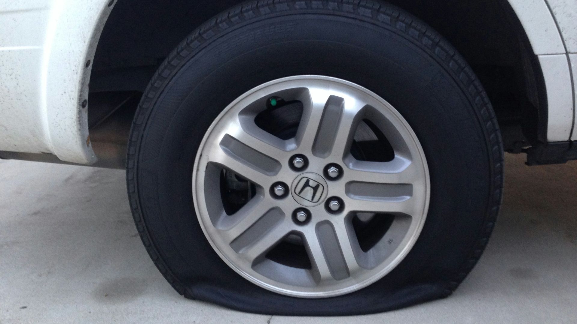 gray 5 spoke wheel with tire
