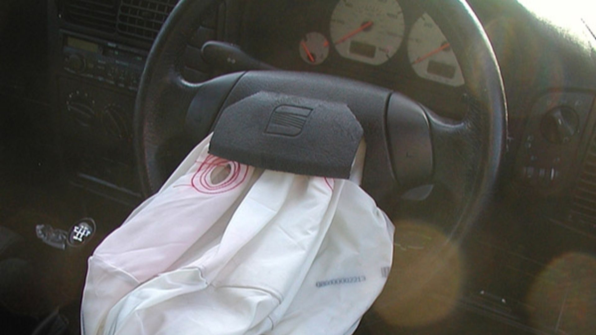 The airbag of a SEAT Ibiza automobile, photographed about an hour after the car had been severely damaged in a road crash.
By 0.3 seconds after inflation, the bag is supposed to be empty.[1]
The driver crashed into the back of a Mercedes in a queue of tra