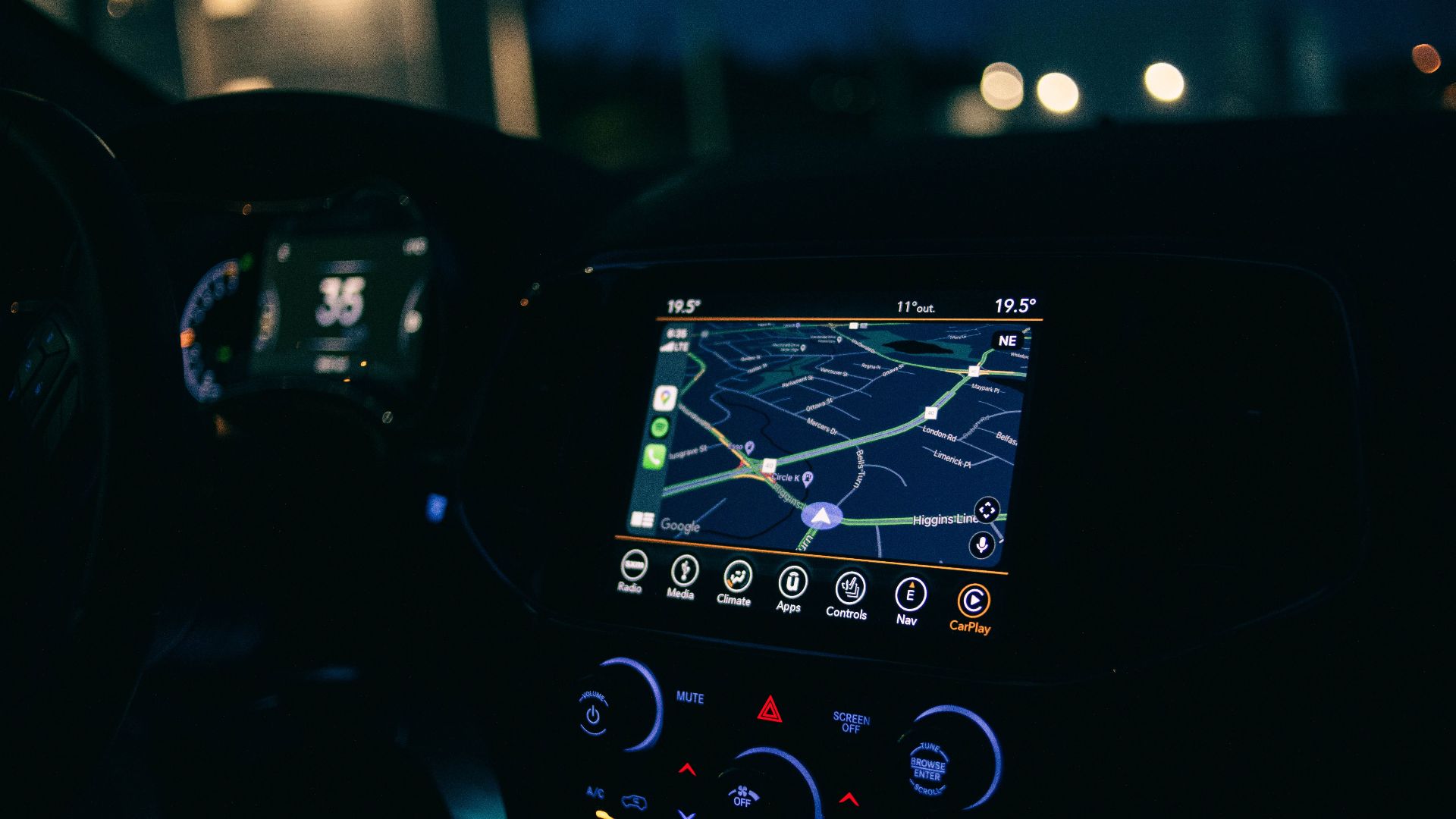 Interior view of a car featuring the GPS navigation system illuminated at night, showcasing technology and modern travel.