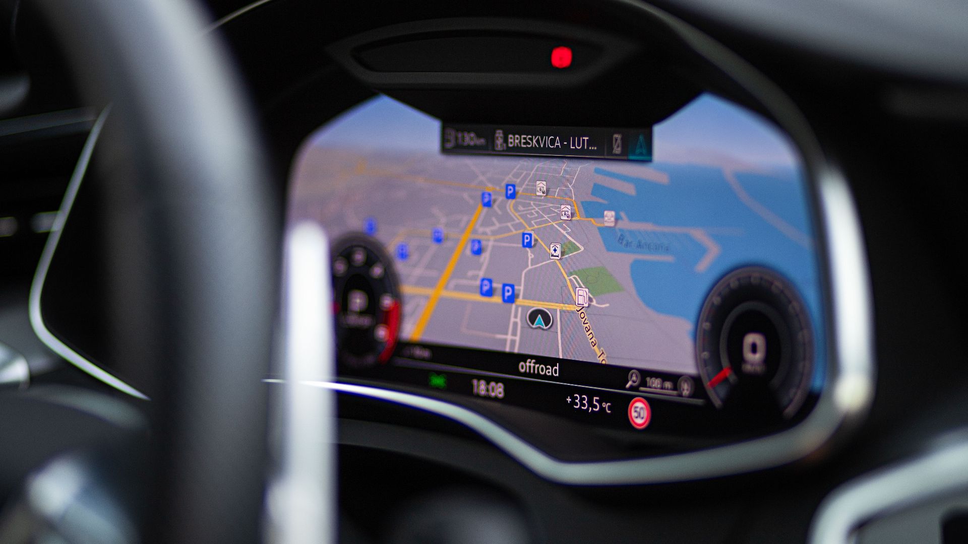Focused view of a car's dashboard showing GPS navigation and map display.