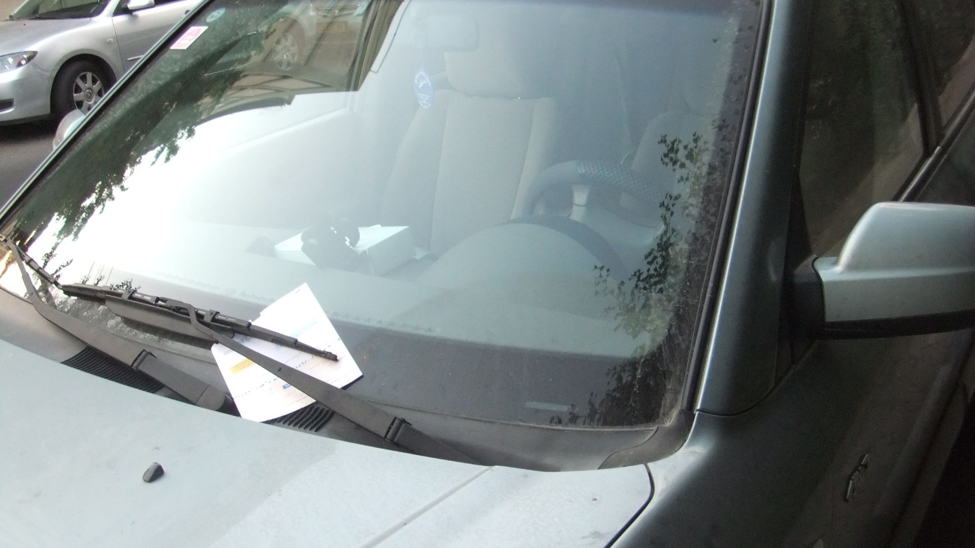 A car with a parking ticket in Tel Aviv