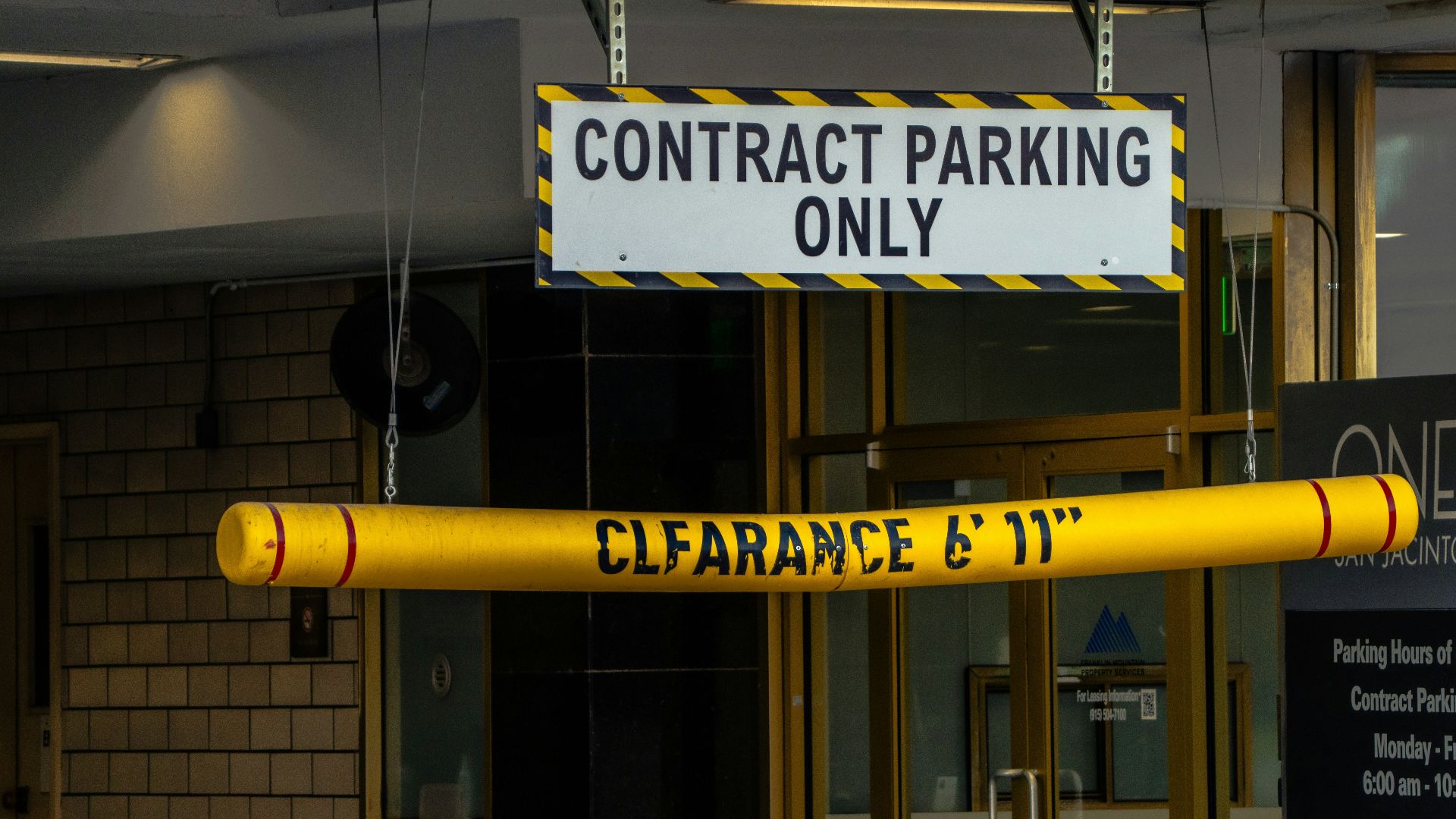 Contract parking only sign with clearance bar.