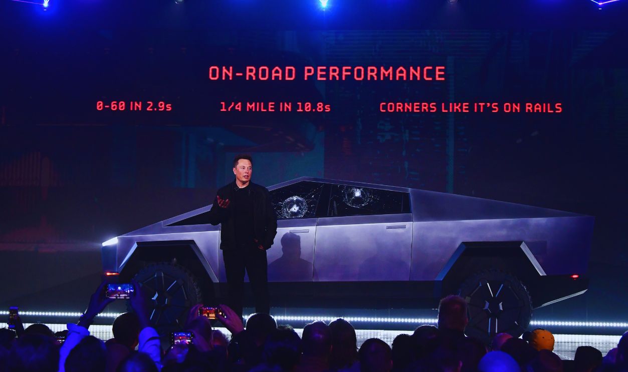Gettyimages - 1183828062, US-AUTOMOBILE-TESLA-CYBERTRUCK Tesla co-founder and CEO Elon Musk stands in front of the newly unveiled all-electric battery-powered Tesla's Cybertruck at Tesla Design Center in Hawthorne, California on November 21, 2019.