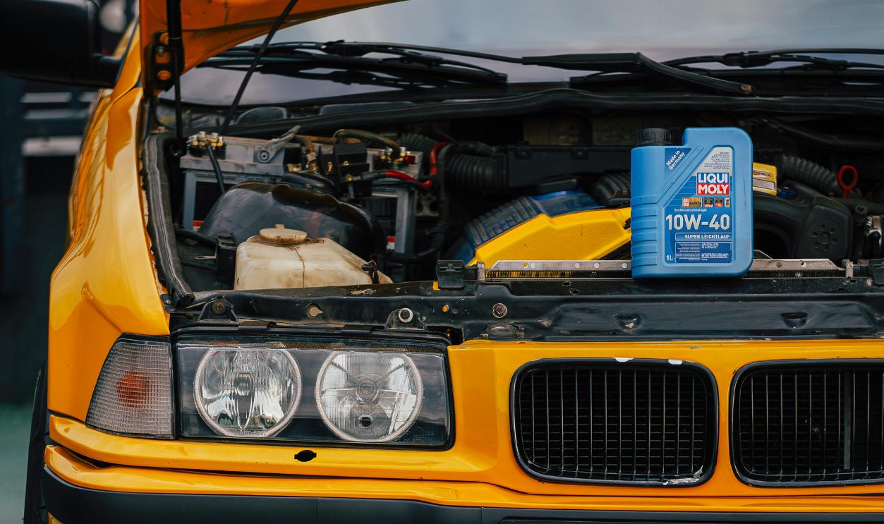 Close-up of car engine and motor oil can at a garage in Sarajevo