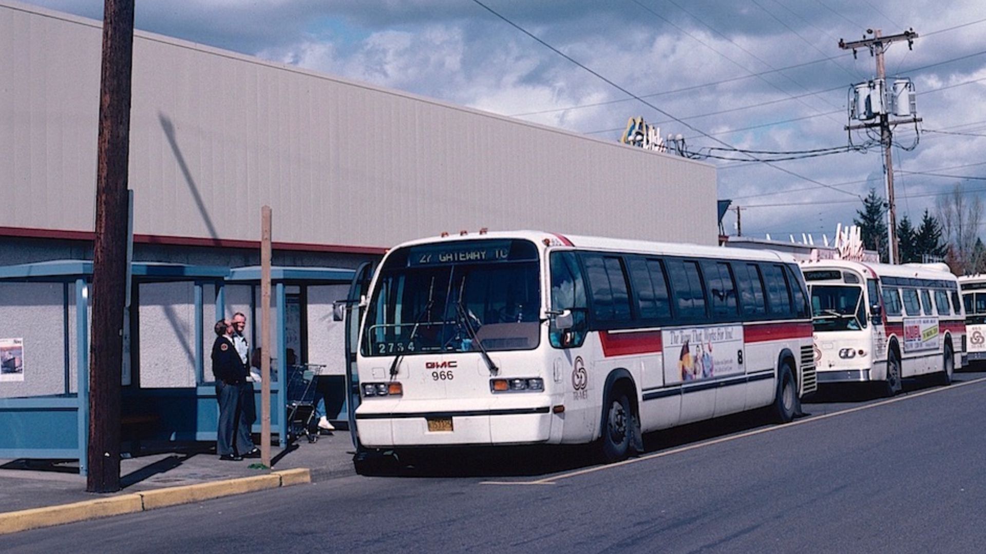 Three buses at TriMet's Rockwood Transit Center, on SE 188th Avenue between Stark Street and Burnside Street, in 1988. This on-street transit center, with very basic amenities, opened concurrent with TriMet's first MAX Light Rail line in September 1986.  