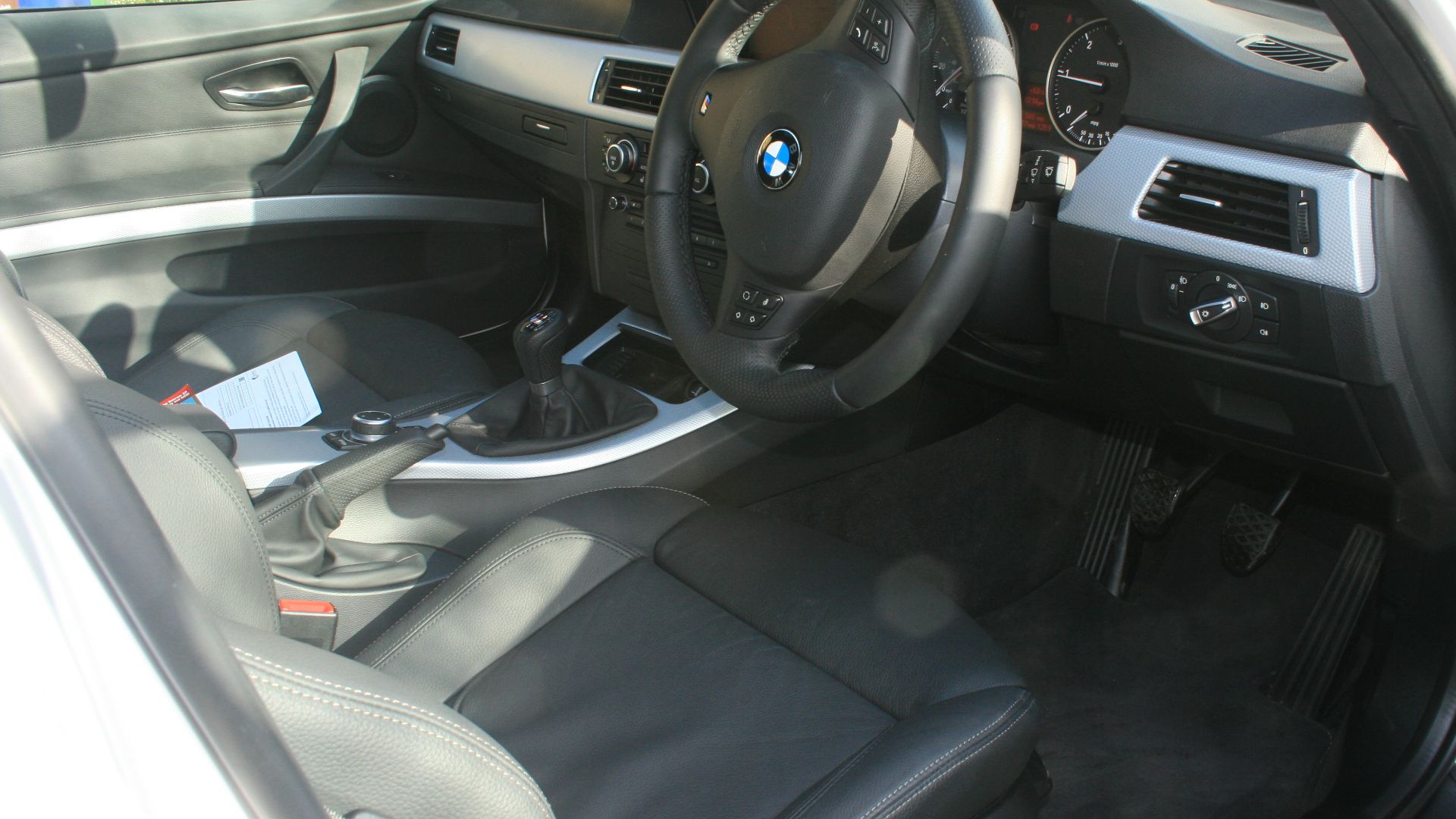 inside my new BMW, includes I-Drive, heated leather seats, sunroof etc
