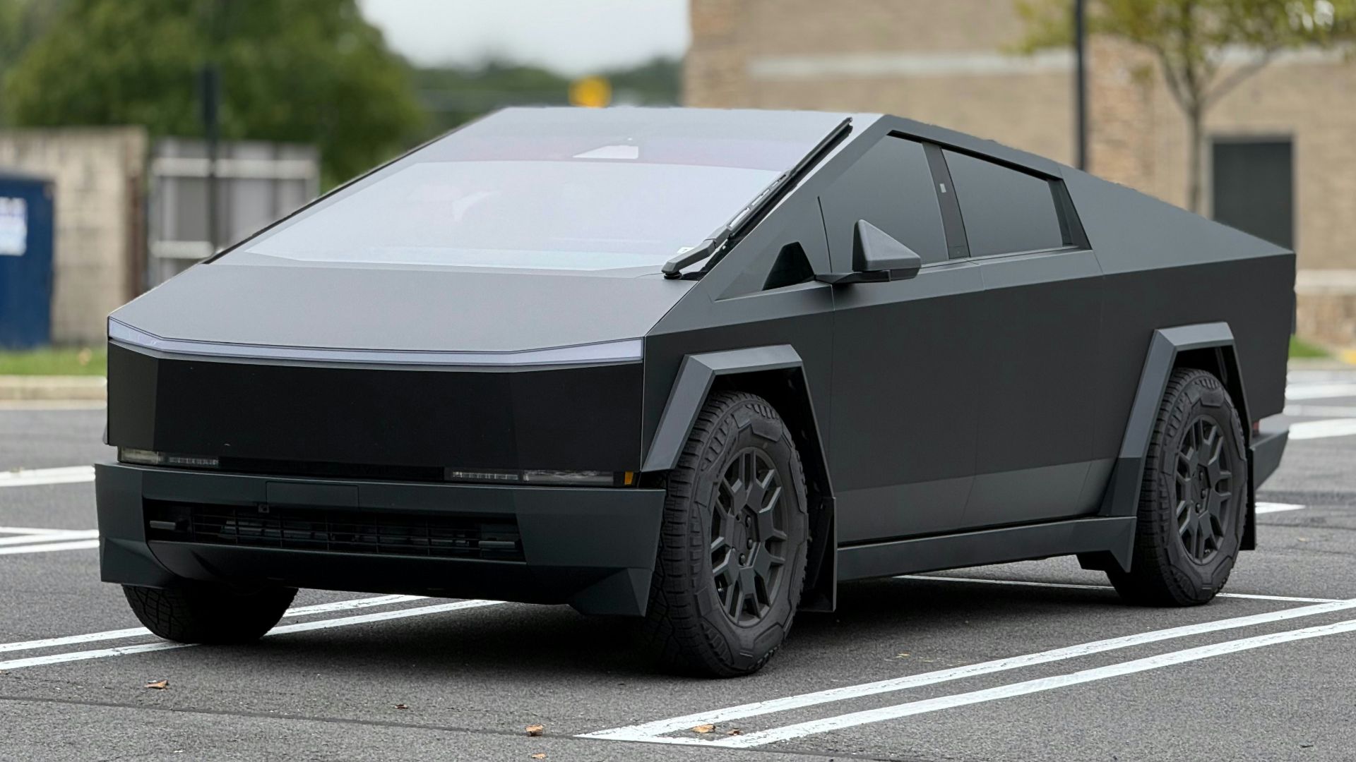 A futuristic car is parked in a parking lot