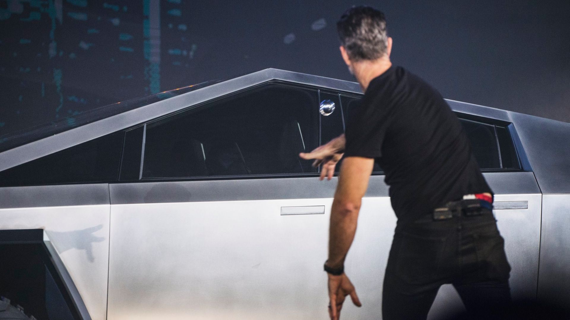 Tesla Cybertruck arriving back in dark; during test ride session after unveiling event.  Motion blur.
