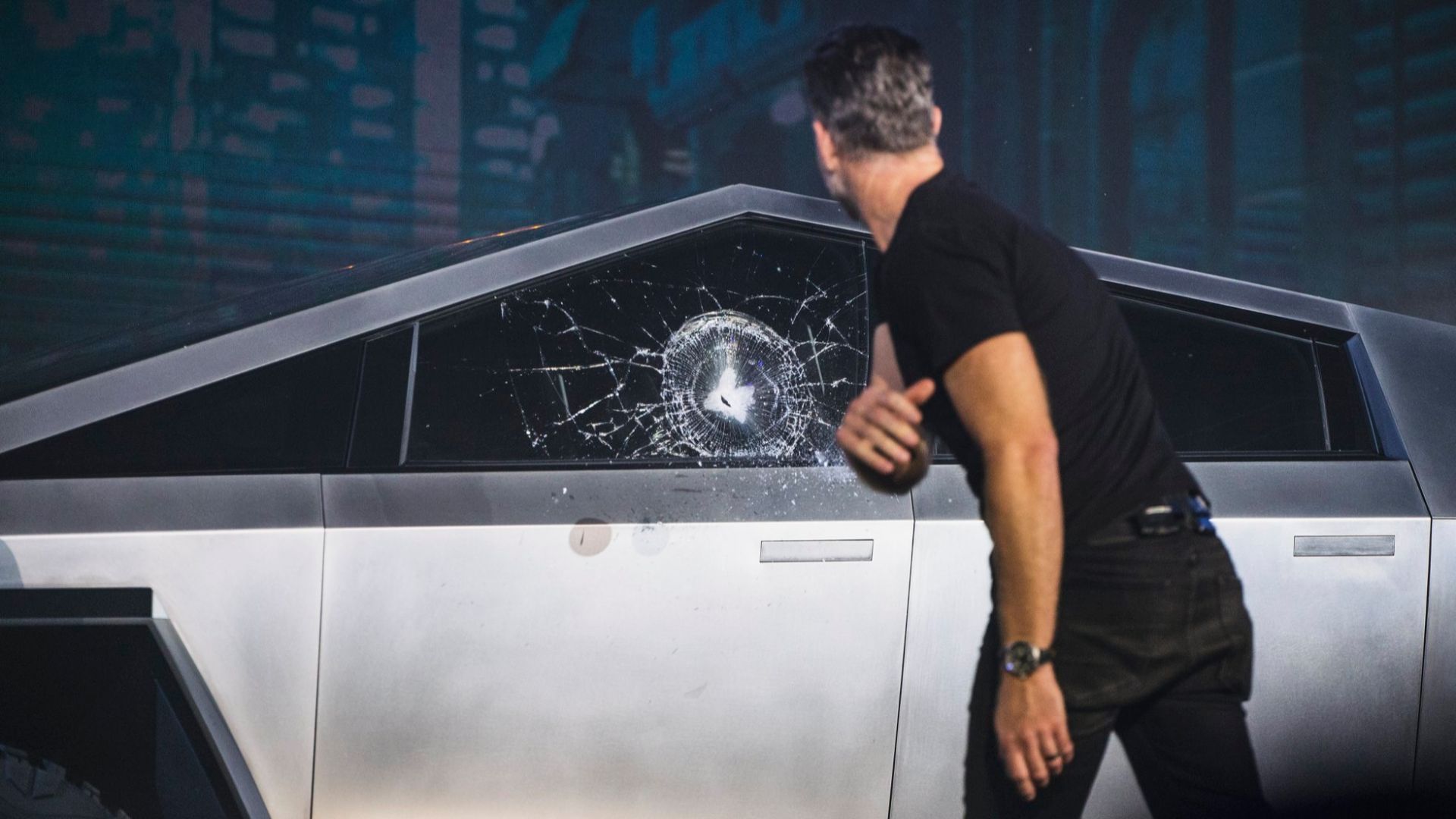 Chief Designer of Tesla throws a steel ball at the window of Cybertruck. The impact, meant to showcase the durability of Tesla glass, instead shattered the Cybertruck's window during the live unveiling event.