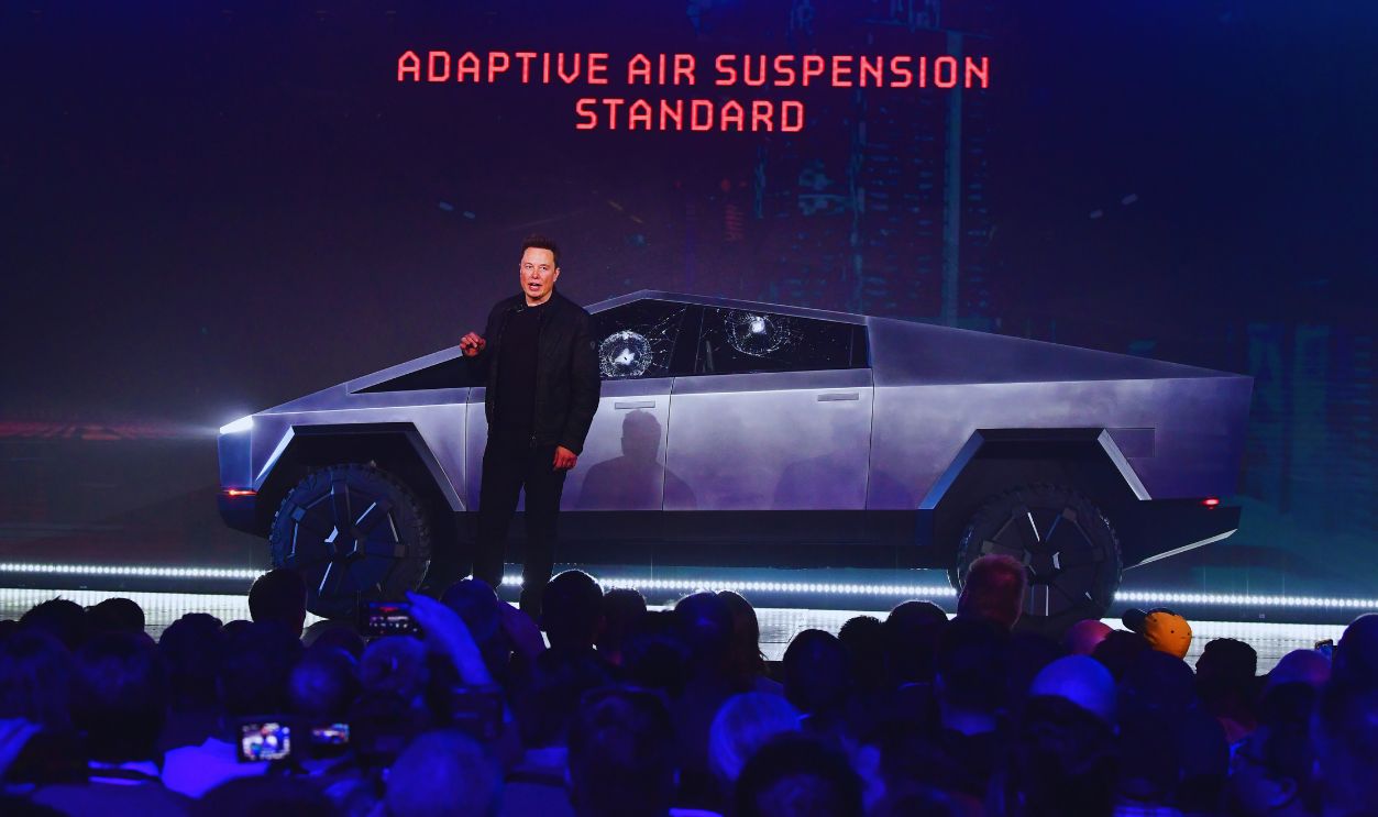 Gettyimages - 1183828054, US-AUTOMOBILE-TESLA-CYBERTRUCK Tesla co-founder and CEO Elon Musk stands in front of the newly unveiled all-electric battery-powered Tesla's Cybertruck at Tesla Design Center in Hawthorne, California on November 21, 2019. 