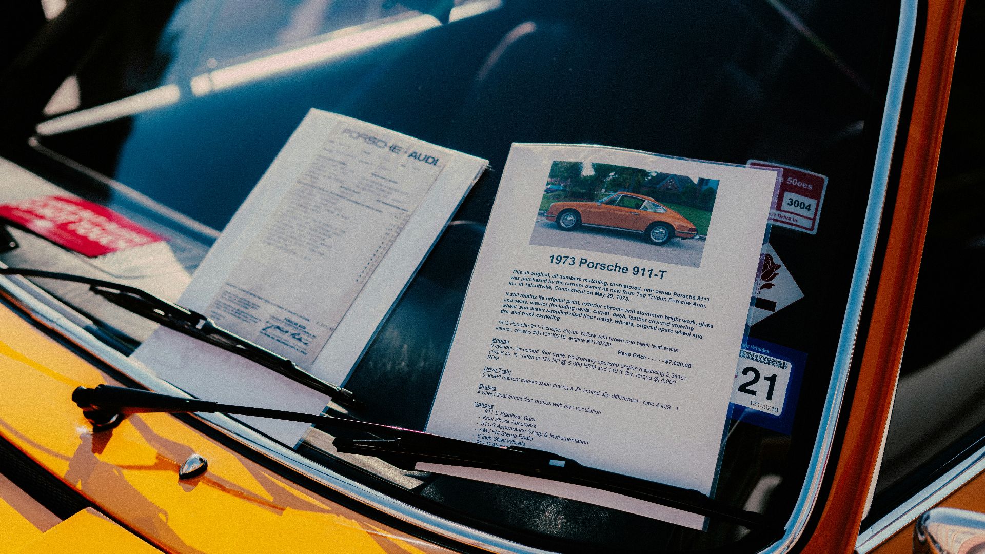 white printer paper on yellow car