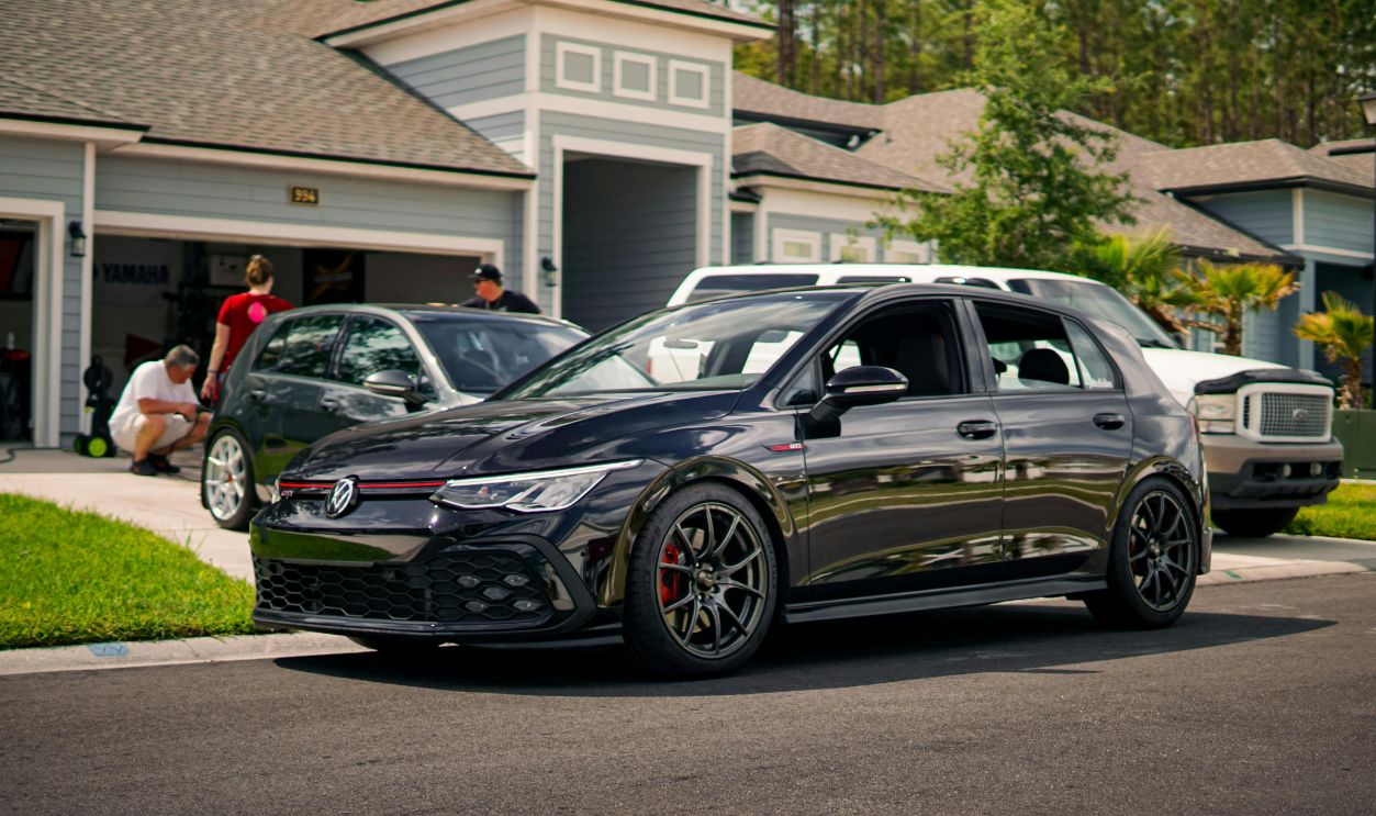 A modern suburban neighborhood featuring a stylish car 