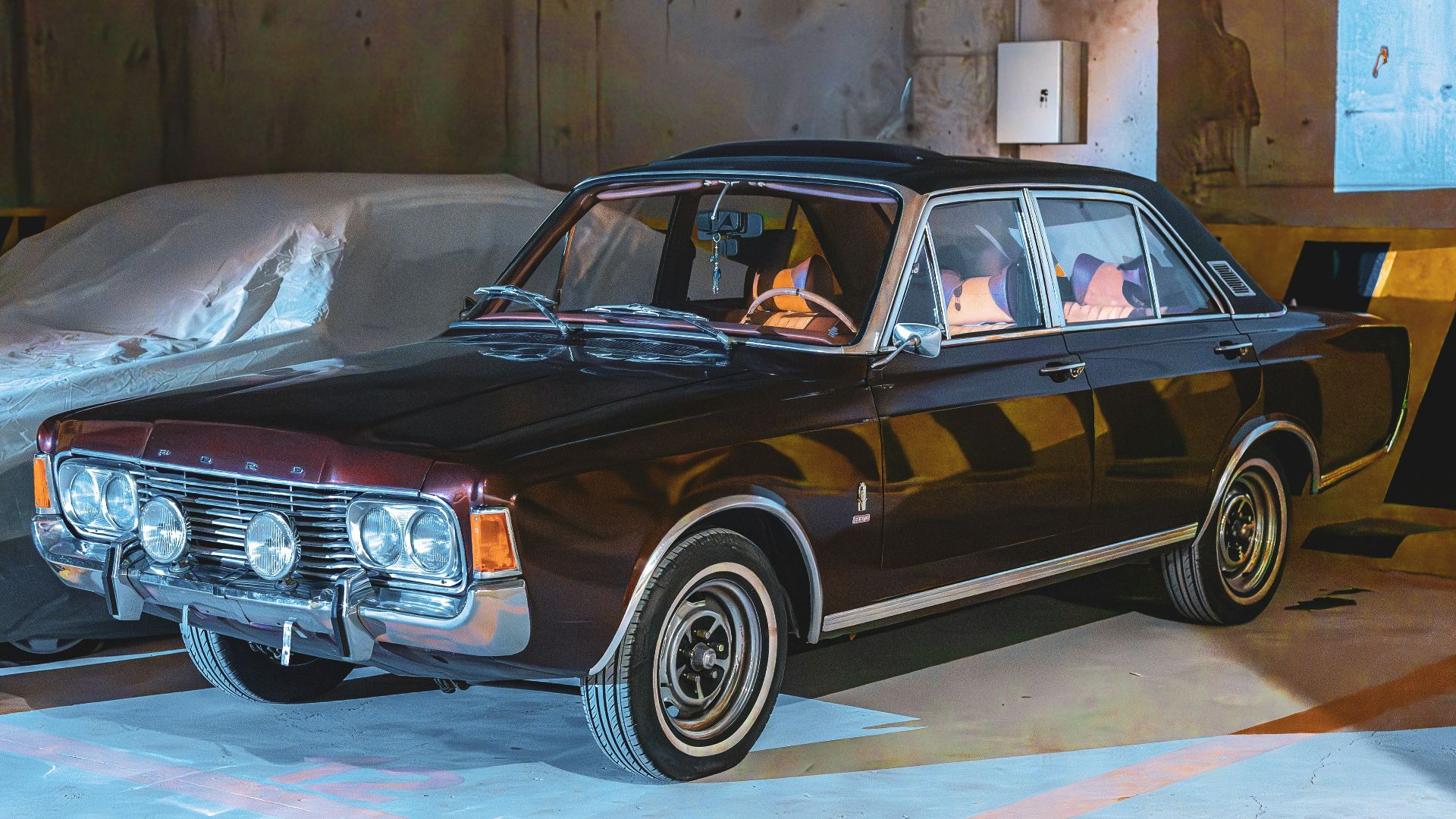Vintage dark brown sedan parked indoors