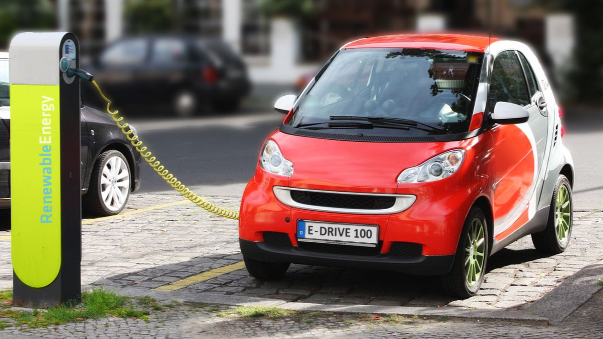 electric car recharging in Berlin, Germany – dummy/fake registration plate and charging station logo