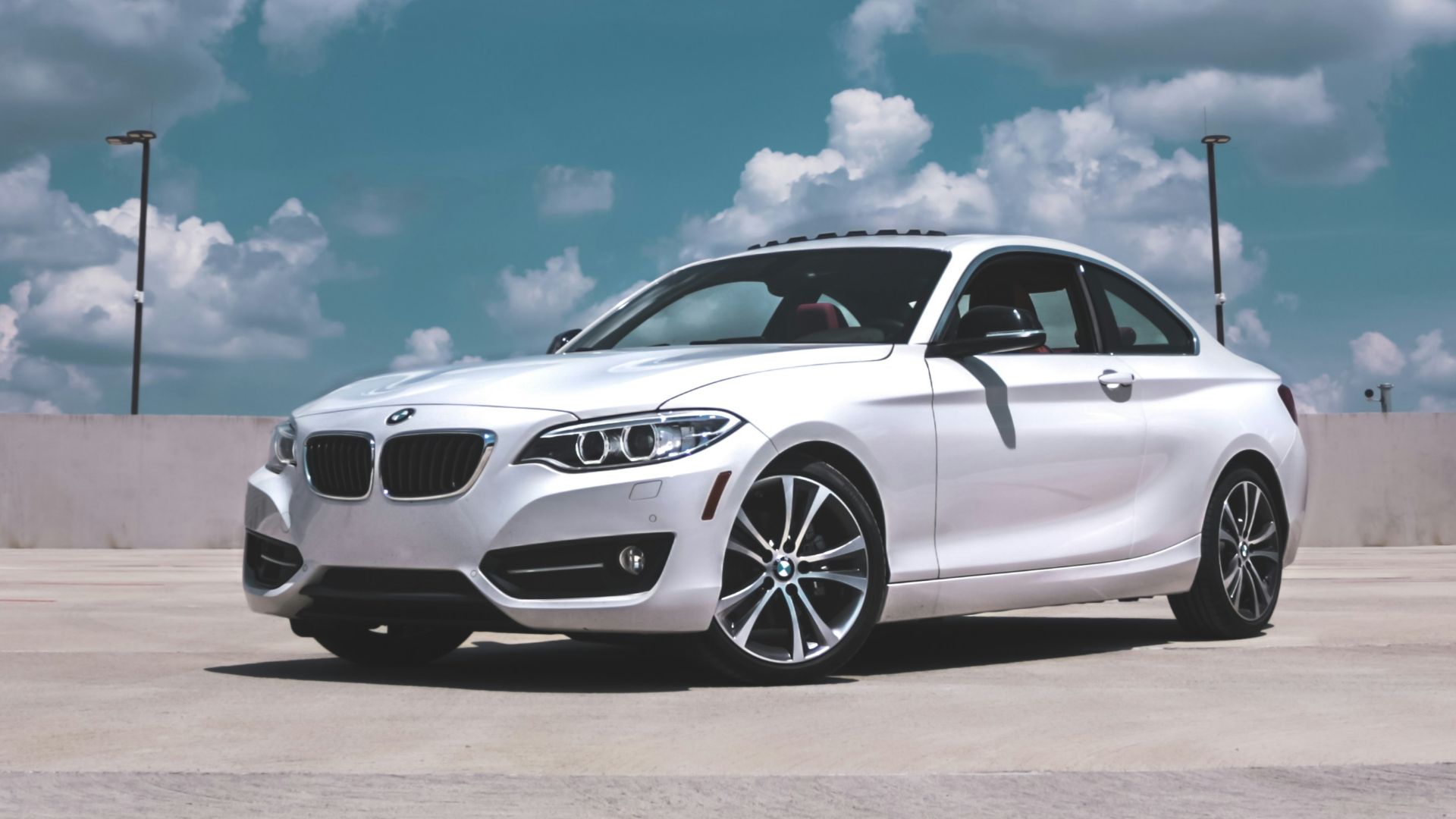 parked white BMW coupe