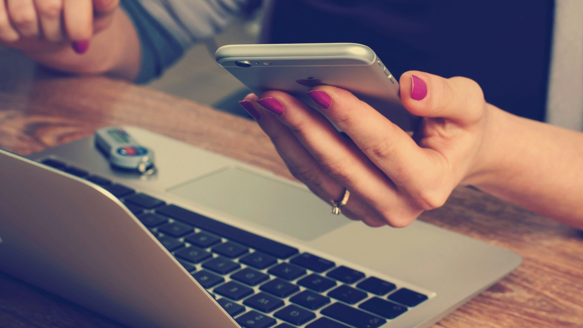 woman holding silver iPhone 6