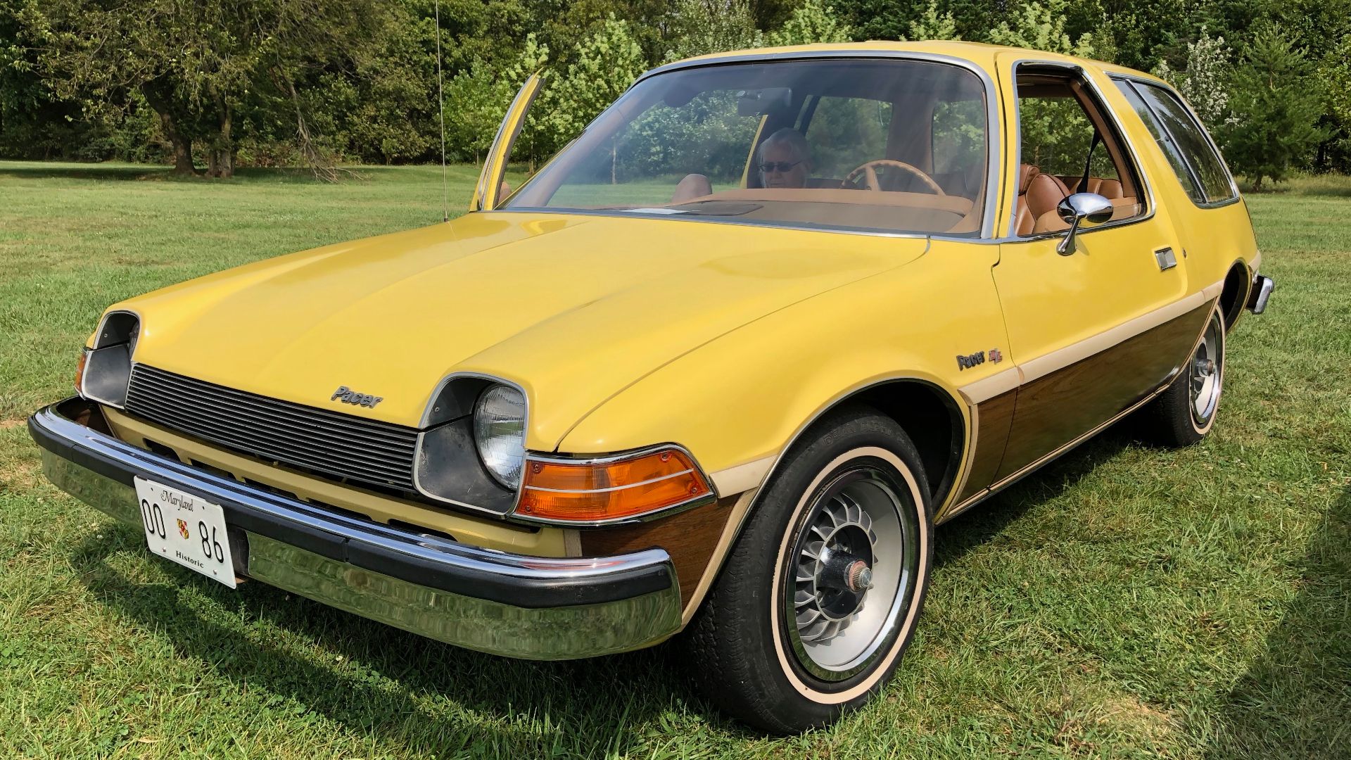 Front left side view of a 1977 AMC Pacer DL two-door station wagon. First model year of the station wagon body style for the Pacer. Built by American Motors Corporation (AMC) in Kenosha, Wisconsin. This Pacer is in original factory condition and finished 