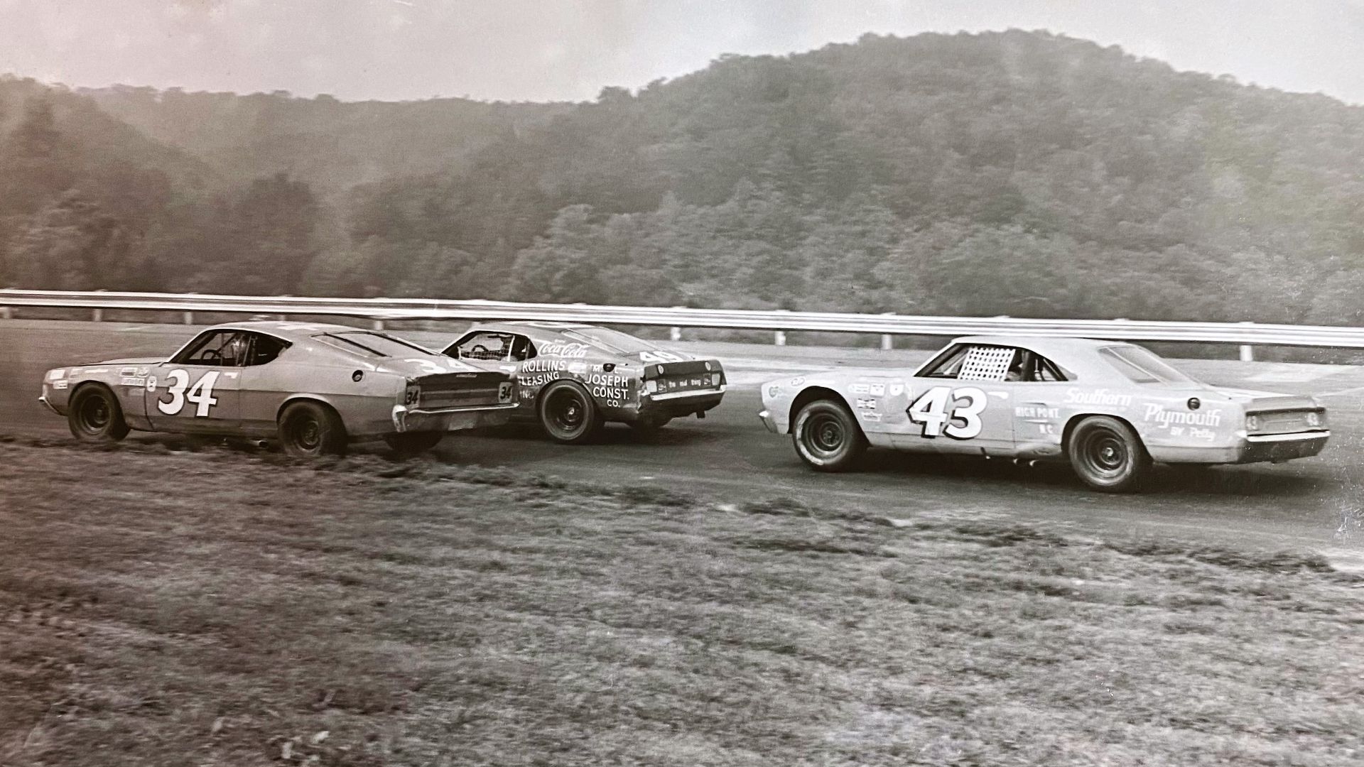 Wendell Scott, Bobby Allison, and Richard Petty race in turn 2 during the 1971 NASCAR race
